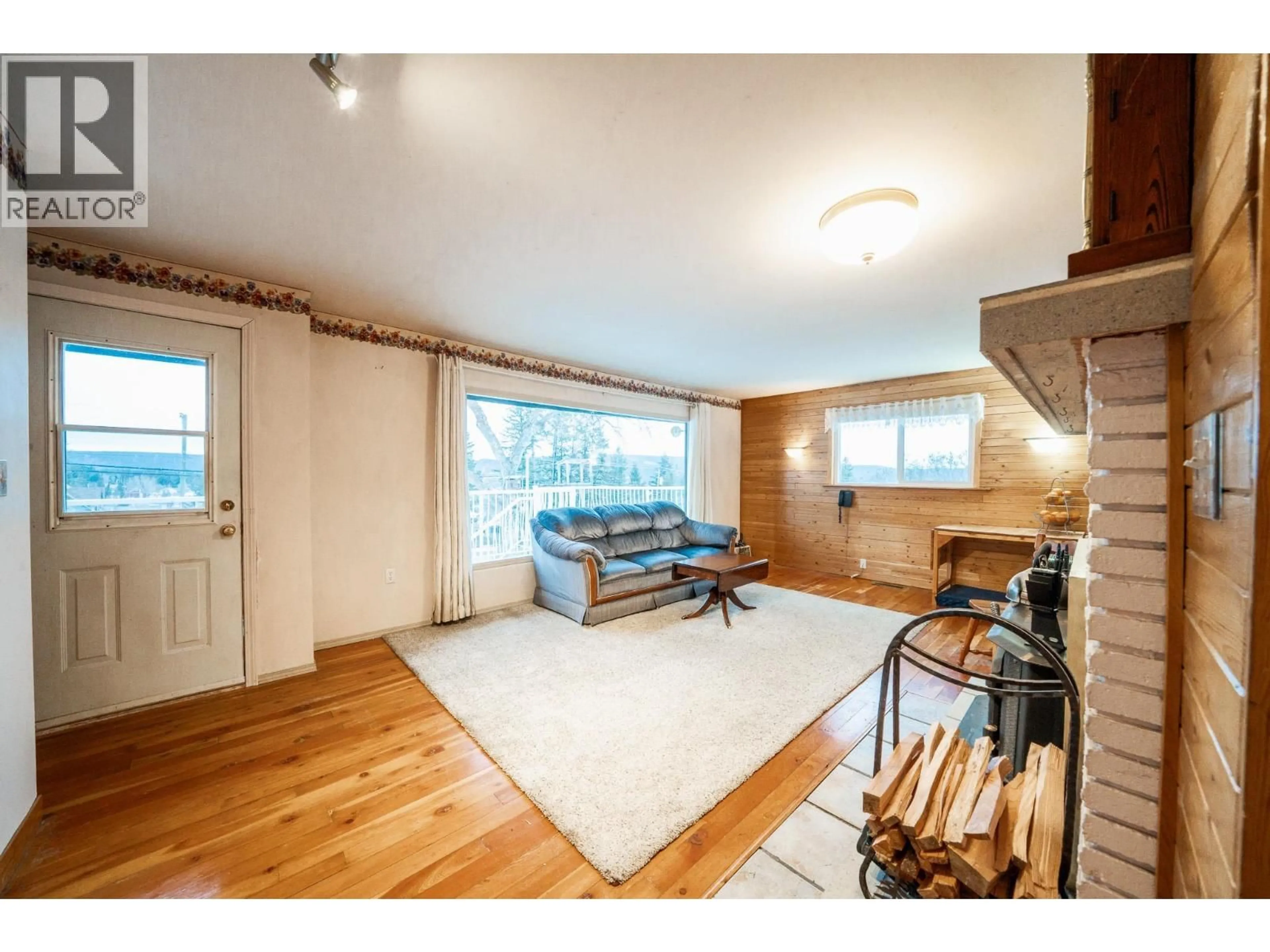 Living room with furniture, wood/laminate floor for 633 HODGSON ROAD, Williams Lake British Columbia V2G3P8