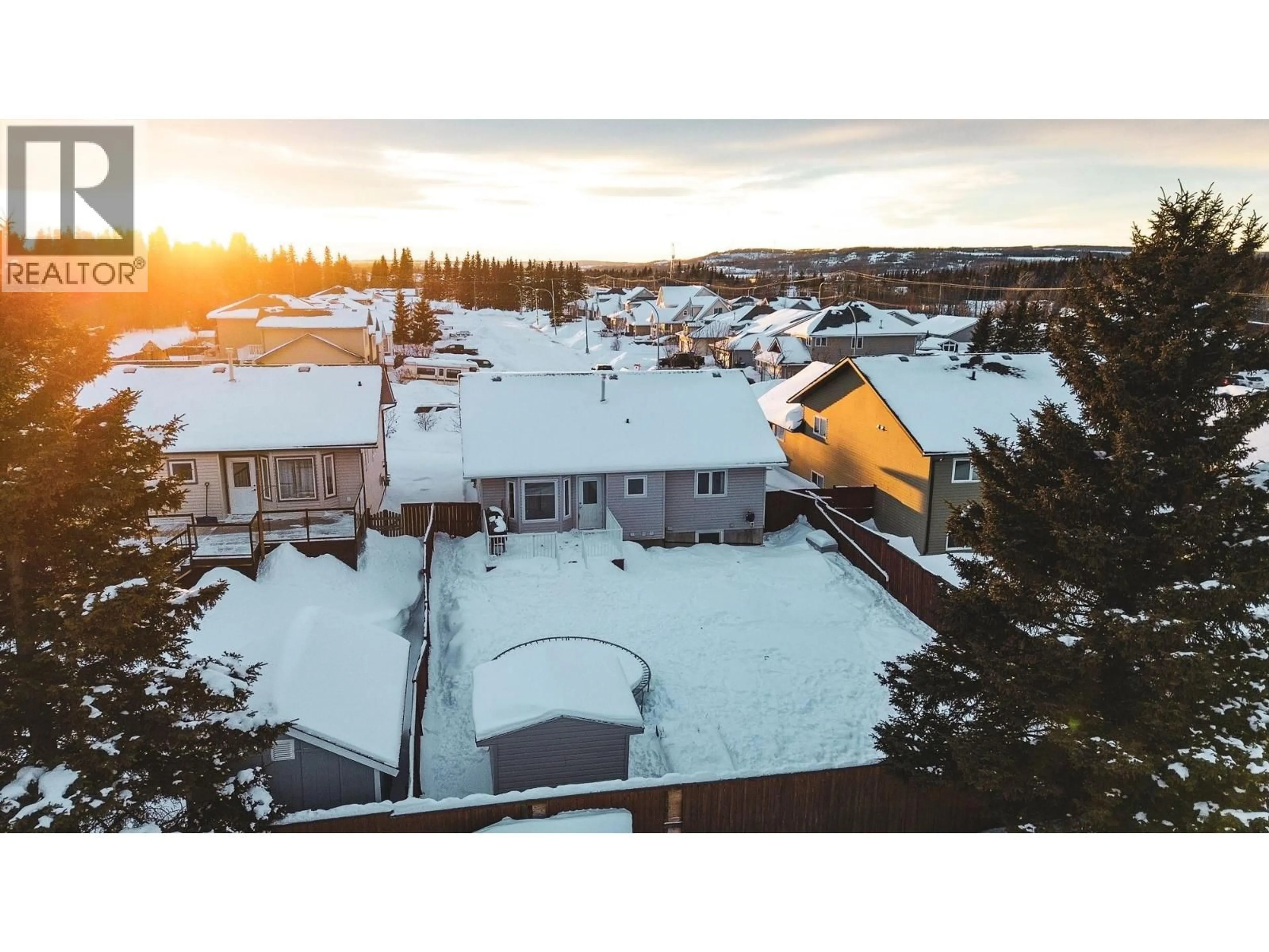 A pic from outside/outdoor area/front of a property/back of a property/a pic from drone, mountain view for 11723 91 STREET, Fort St. John British Columbia V1J0B3