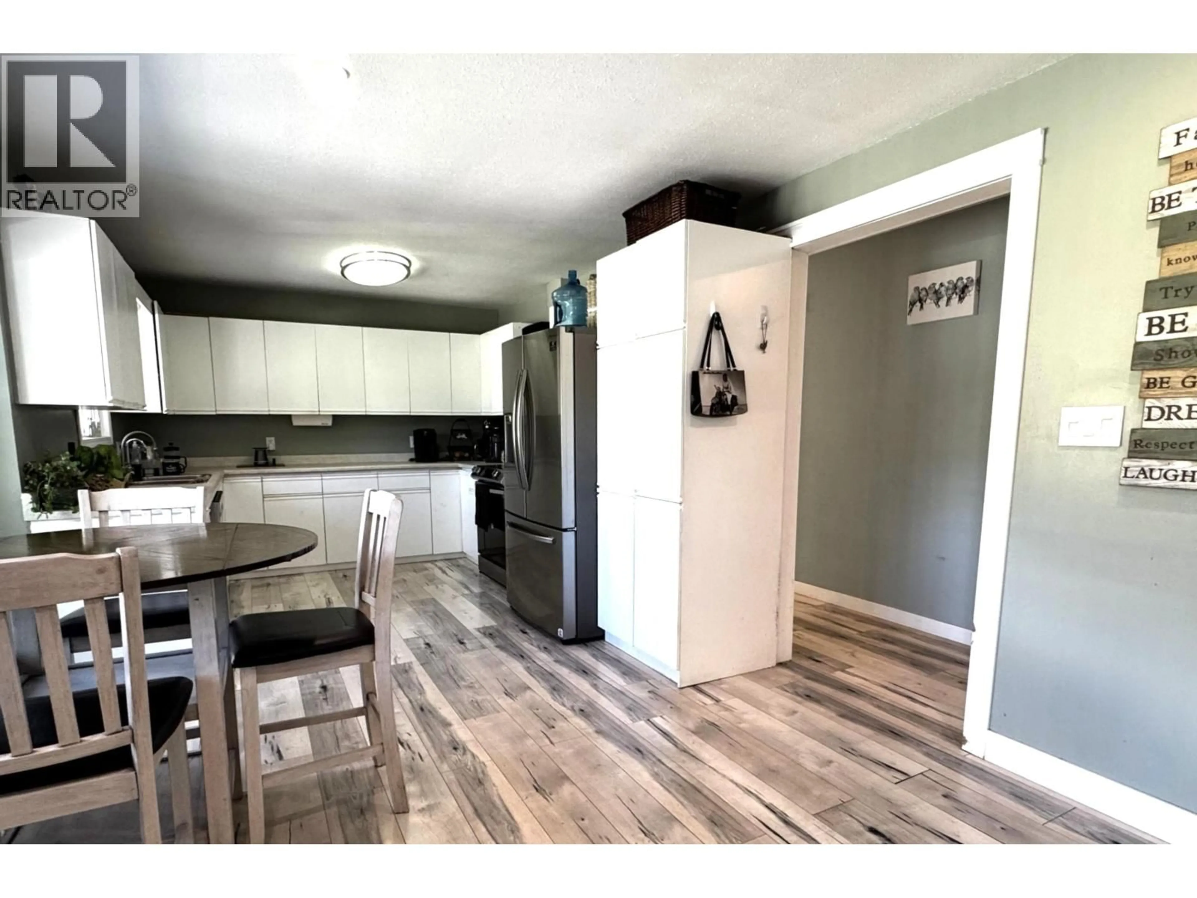 Open concept kitchen, wood/laminate floor for 2484 BAILEY ROAD, Williams Lake British Columbia V2G5B9