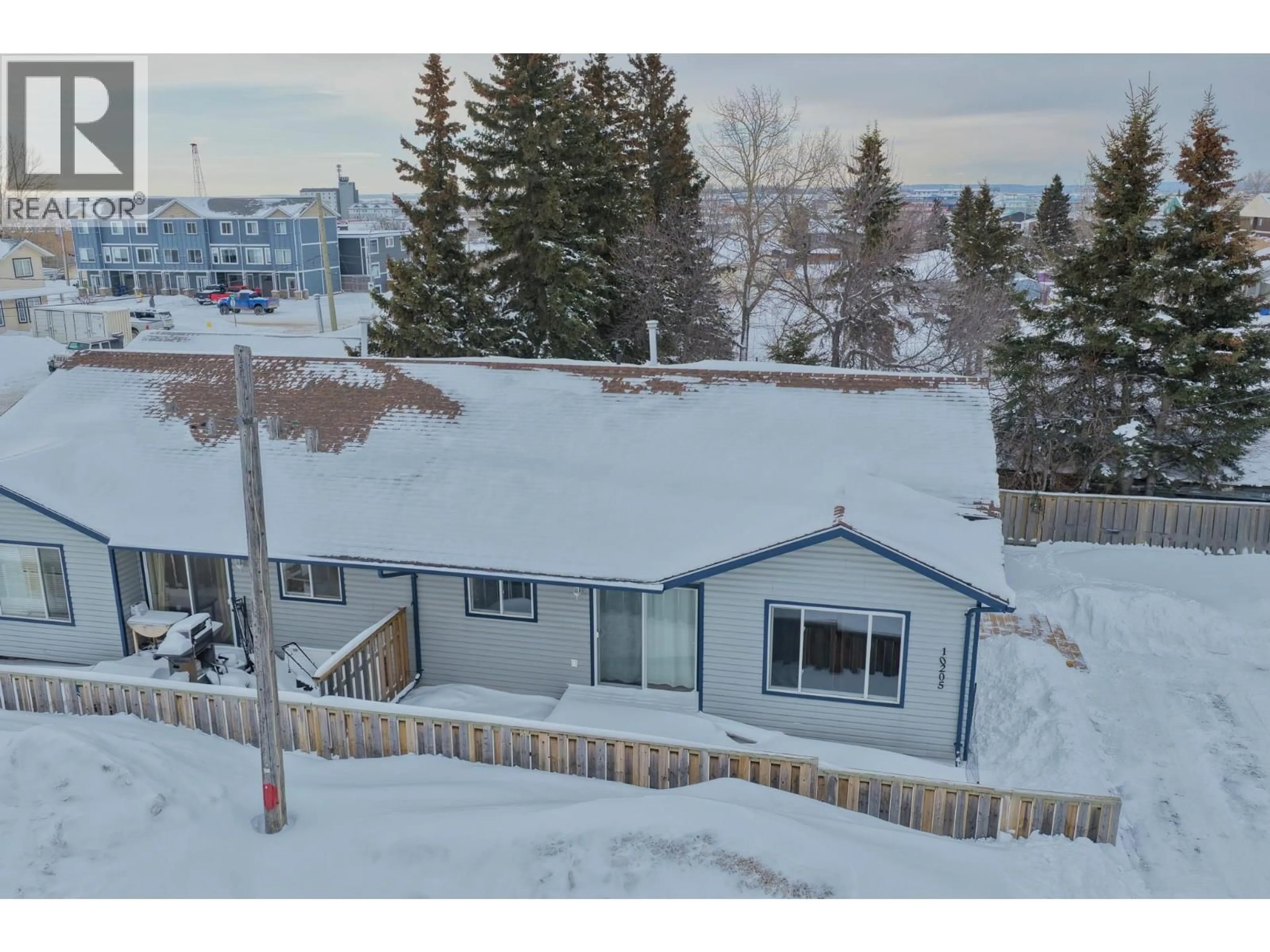 A pic from outside/outdoor area/front of a property/back of a property/a pic from drone, mountain view for 10205 98 AVENUE, Fort St. John British Columbia V1J0B1