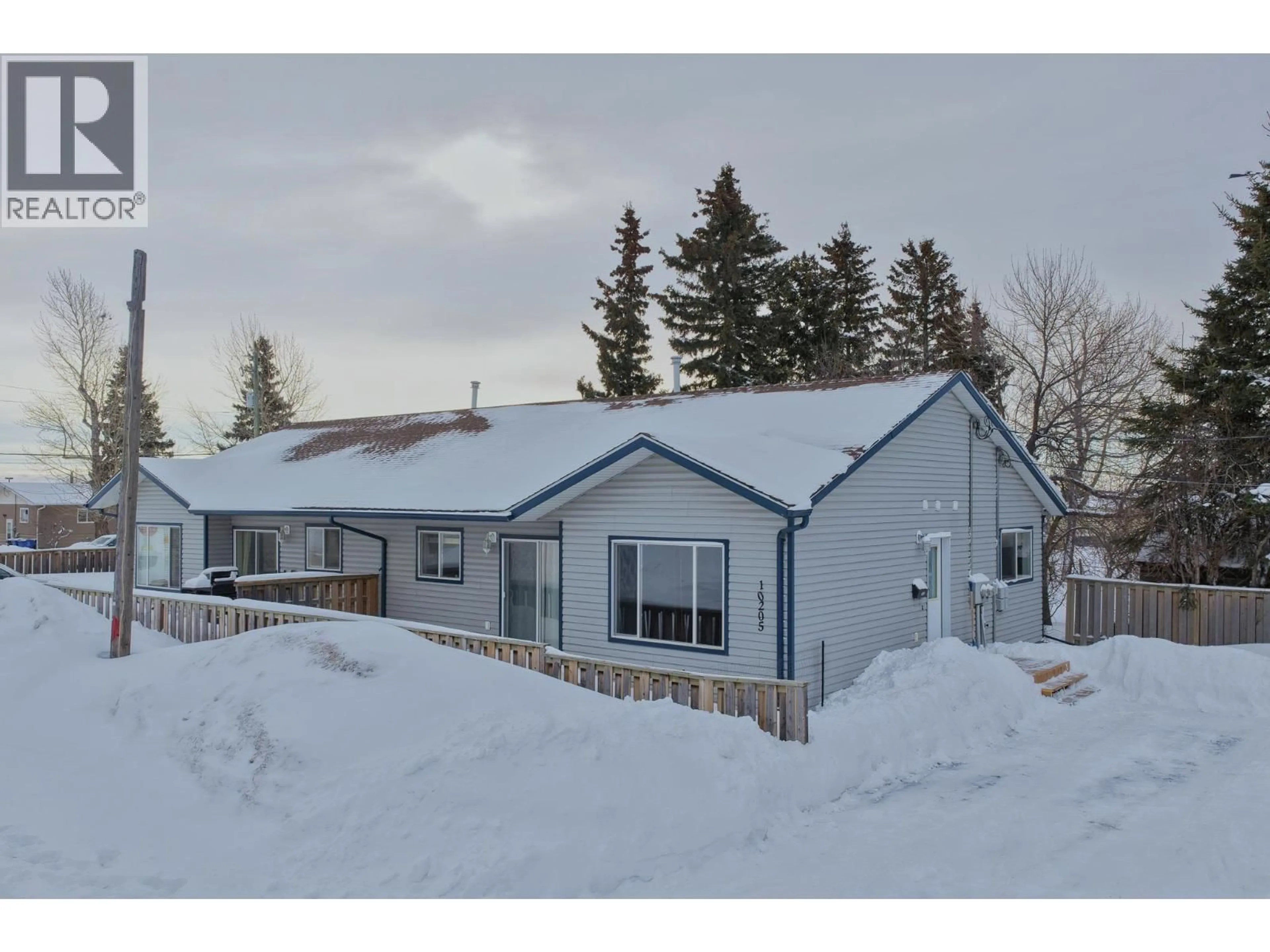 A pic from outside/outdoor area/front of a property/back of a property/a pic from drone, street for 10205 98 AVENUE, Fort St. John British Columbia V1J0B1