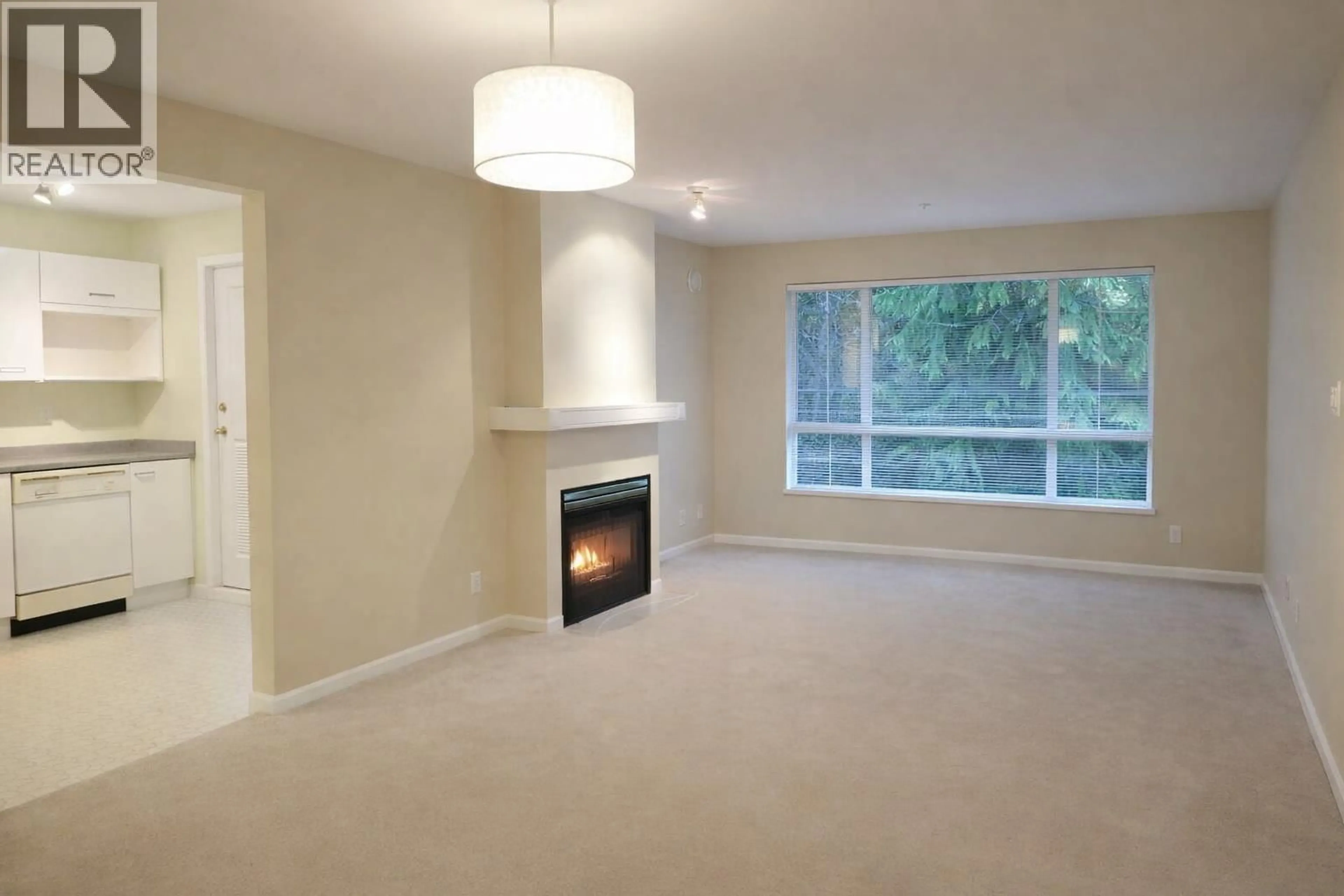 Living room with furniture, carpet floor for 215 - 1242 TOWN CENTRE BOULEVARD, Coquitlam British Columbia V3B7R6