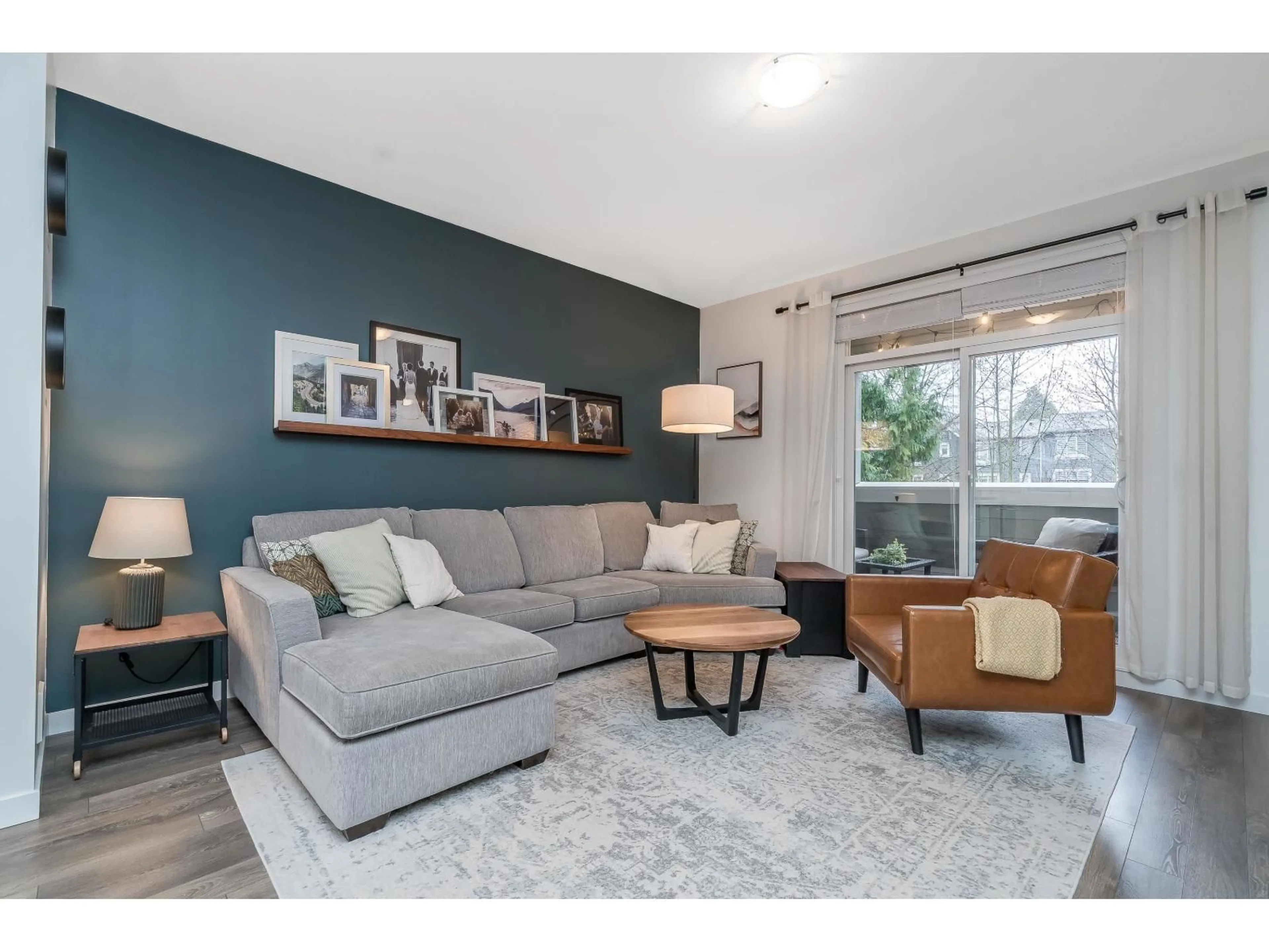 Living room with furniture, wood/laminate floor for 35 - 16357 15 AVENUE, Surrey British Columbia V4A0C2