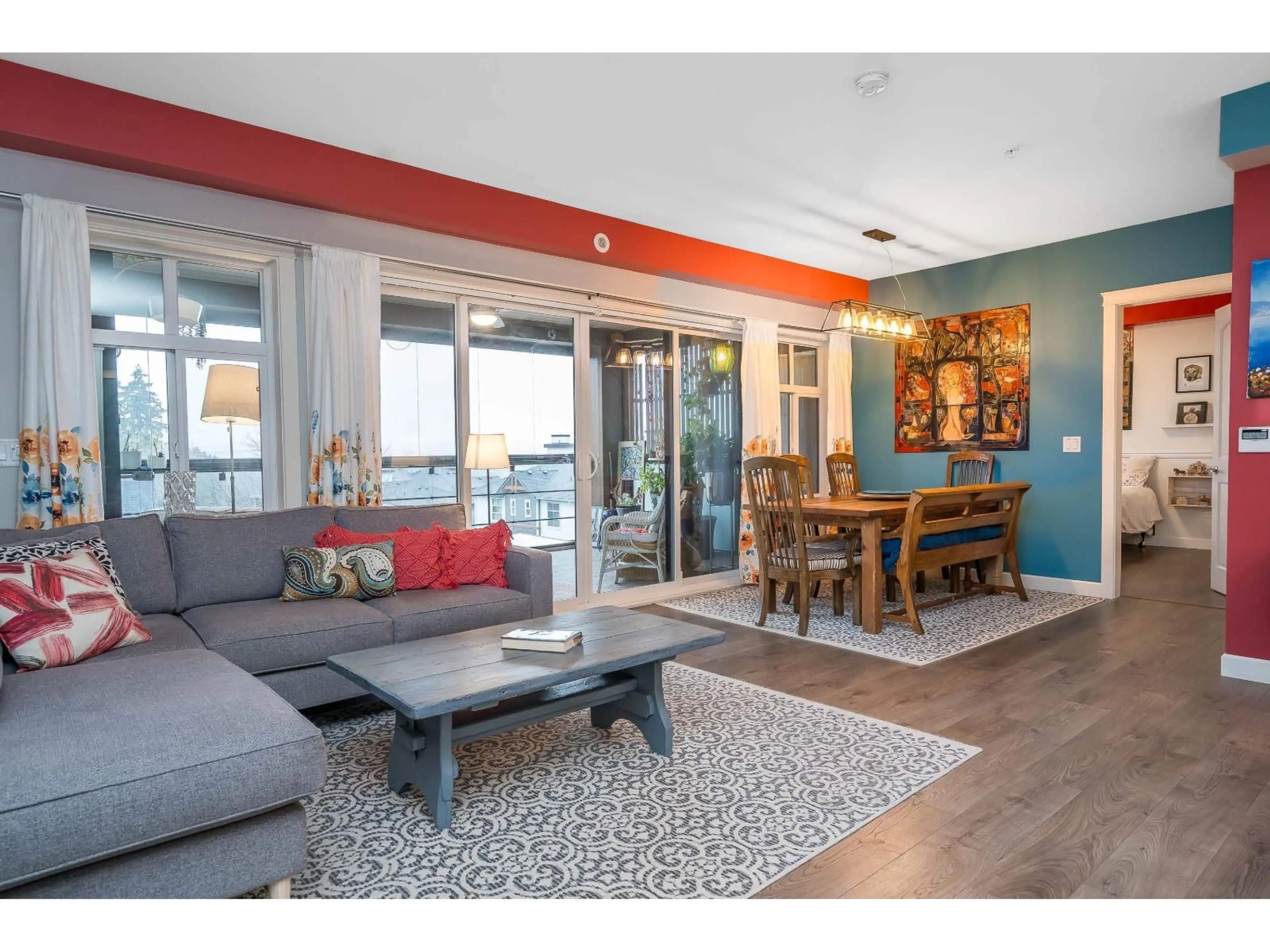 Living room with furniture, wood/laminate floor for 401 - 14588 MCDOUGALL DRIVE, Surrey British Columbia V4P0H1