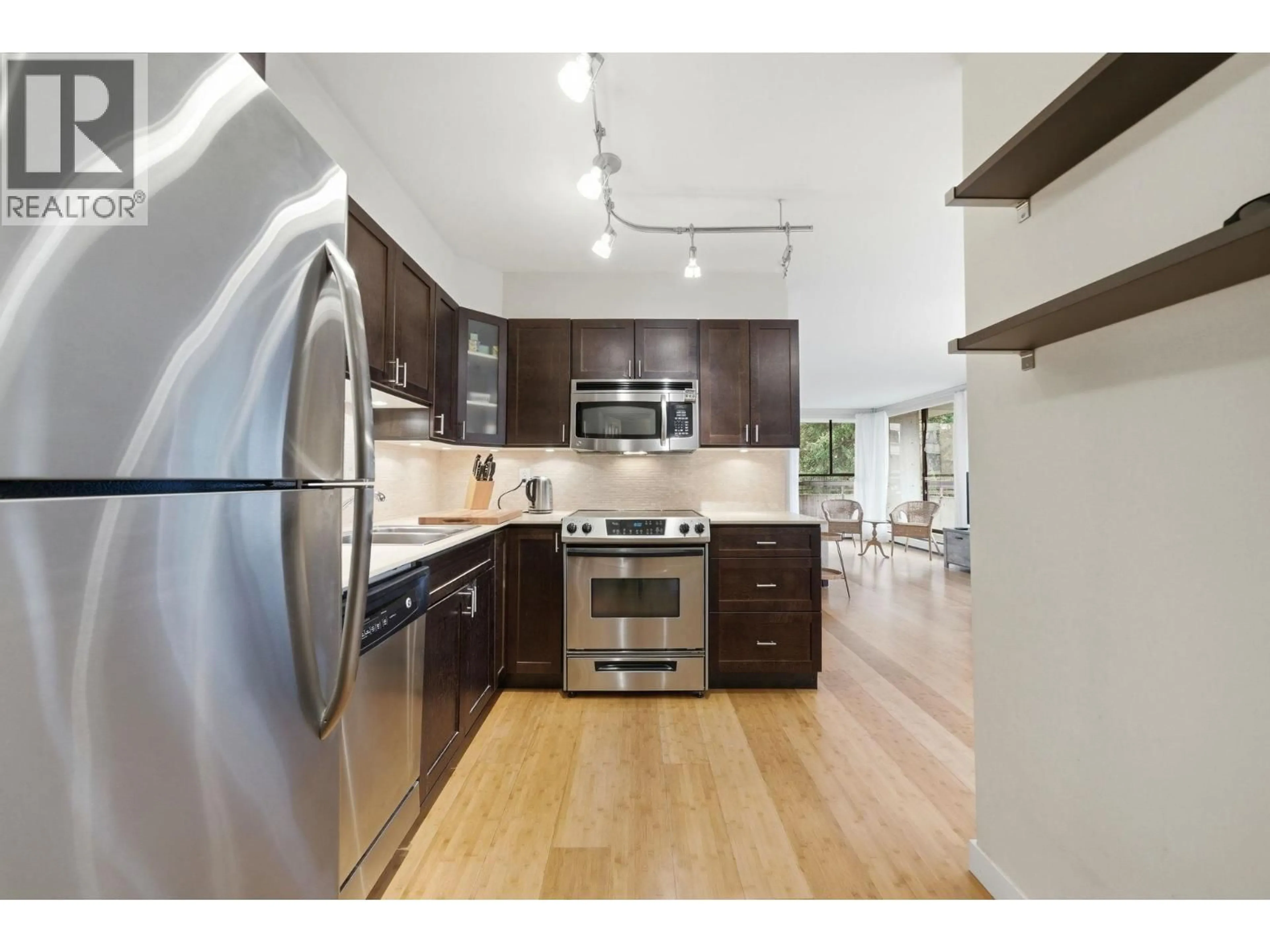 Open concept kitchen, wood/laminate floor for 503 - 3755 BARTLETT COURT, Burnaby British Columbia V3J7G7