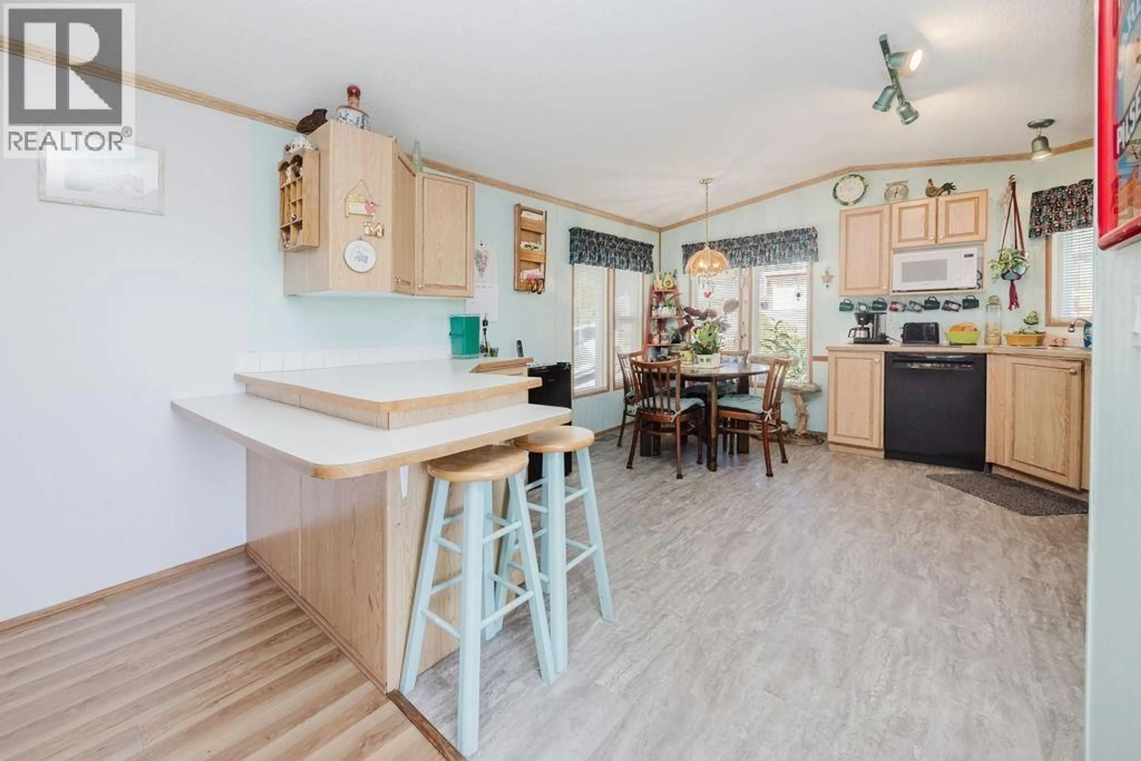 Open concept kitchen, wood/laminate floor for 753 STEINBRUNNER ROAD, Gibsons British Columbia V0N1V9