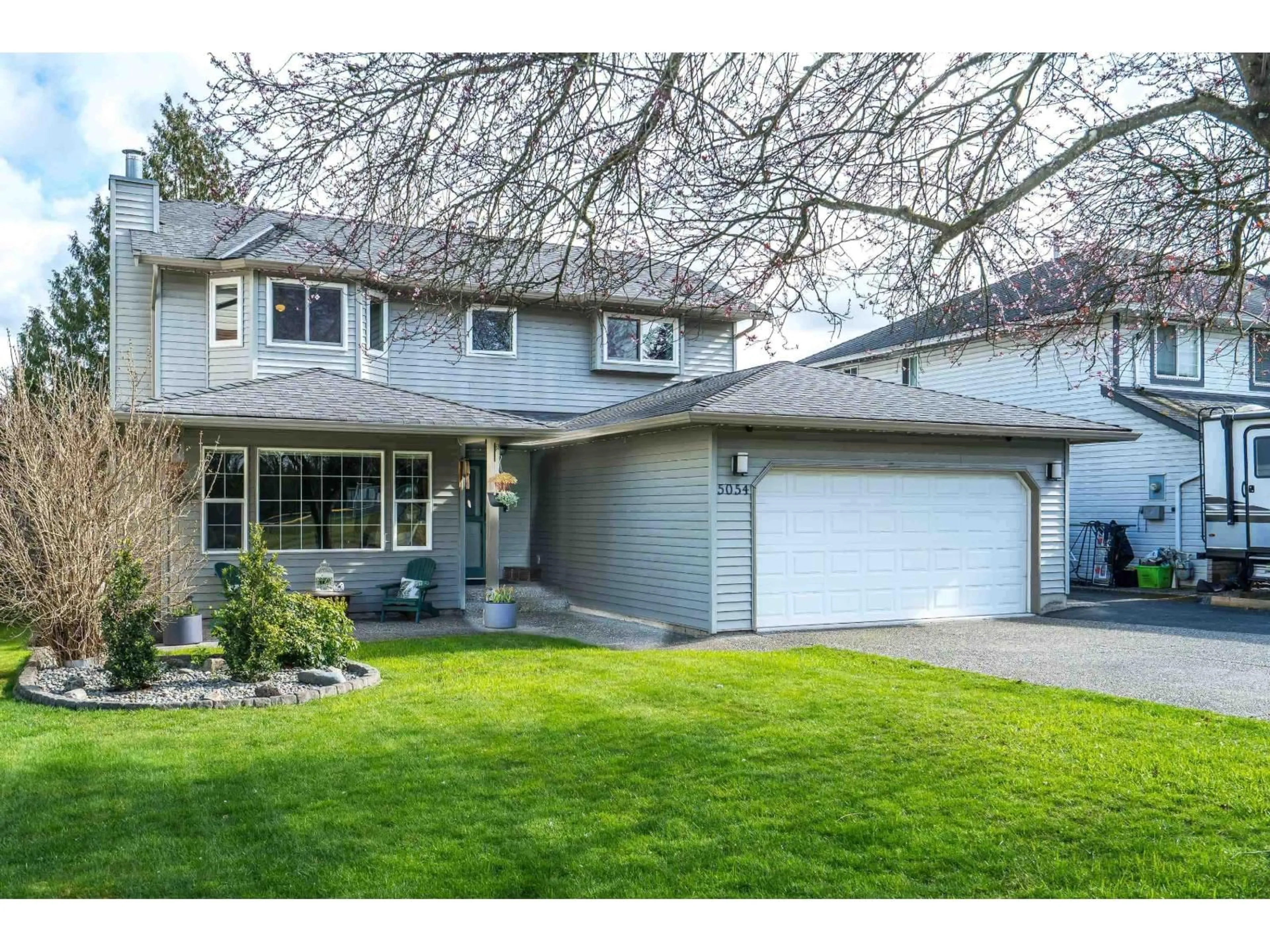 Home with vinyl exterior material, street for 5054 207 STREET, Langley British Columbia V3A7T8