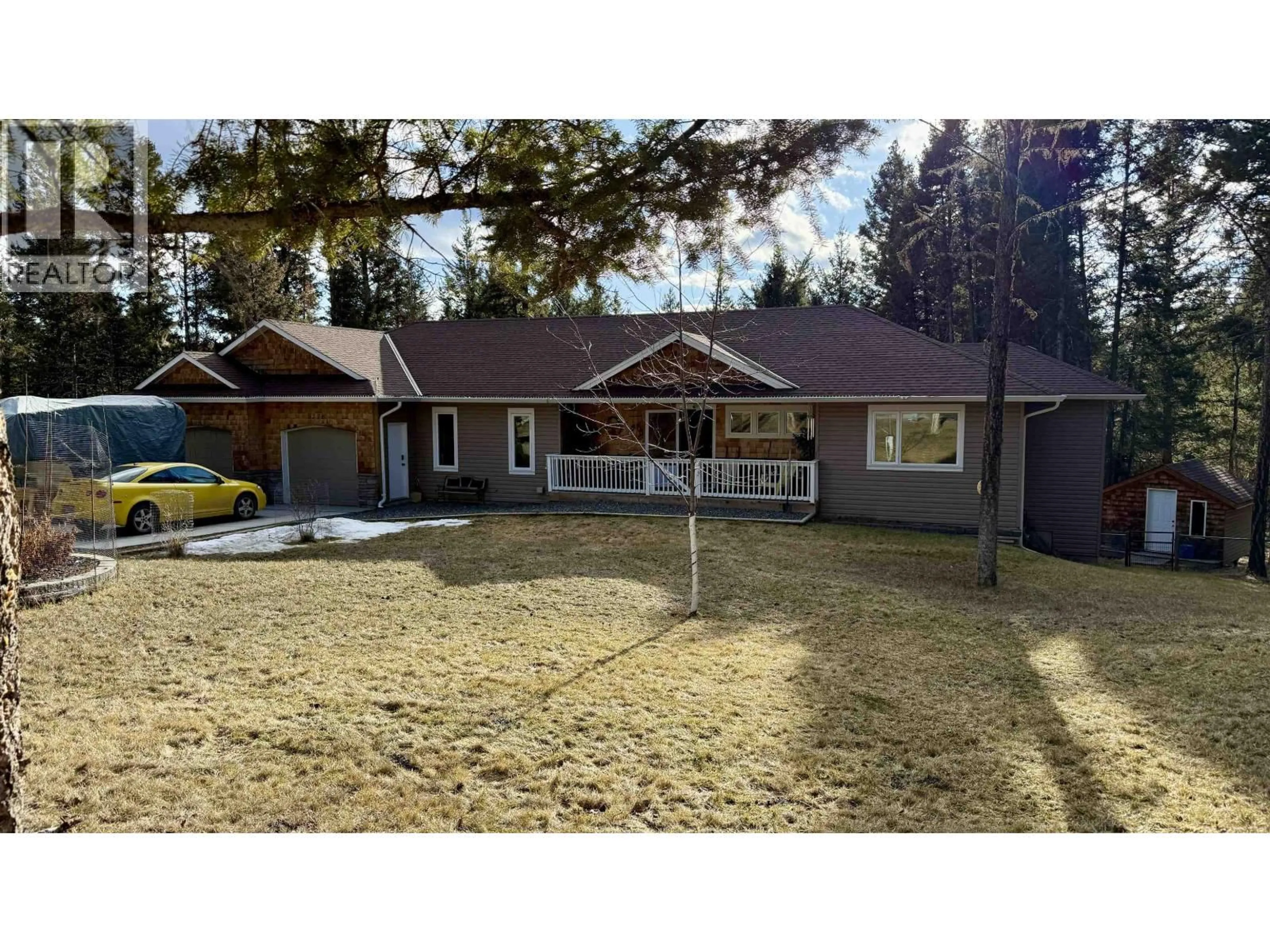 A pic from outside/outdoor area/front of a property/back of a property/a pic from drone, street for 5276 CHINTU DRIVE, 108 Mile Ranch British Columbia V0K2Z0