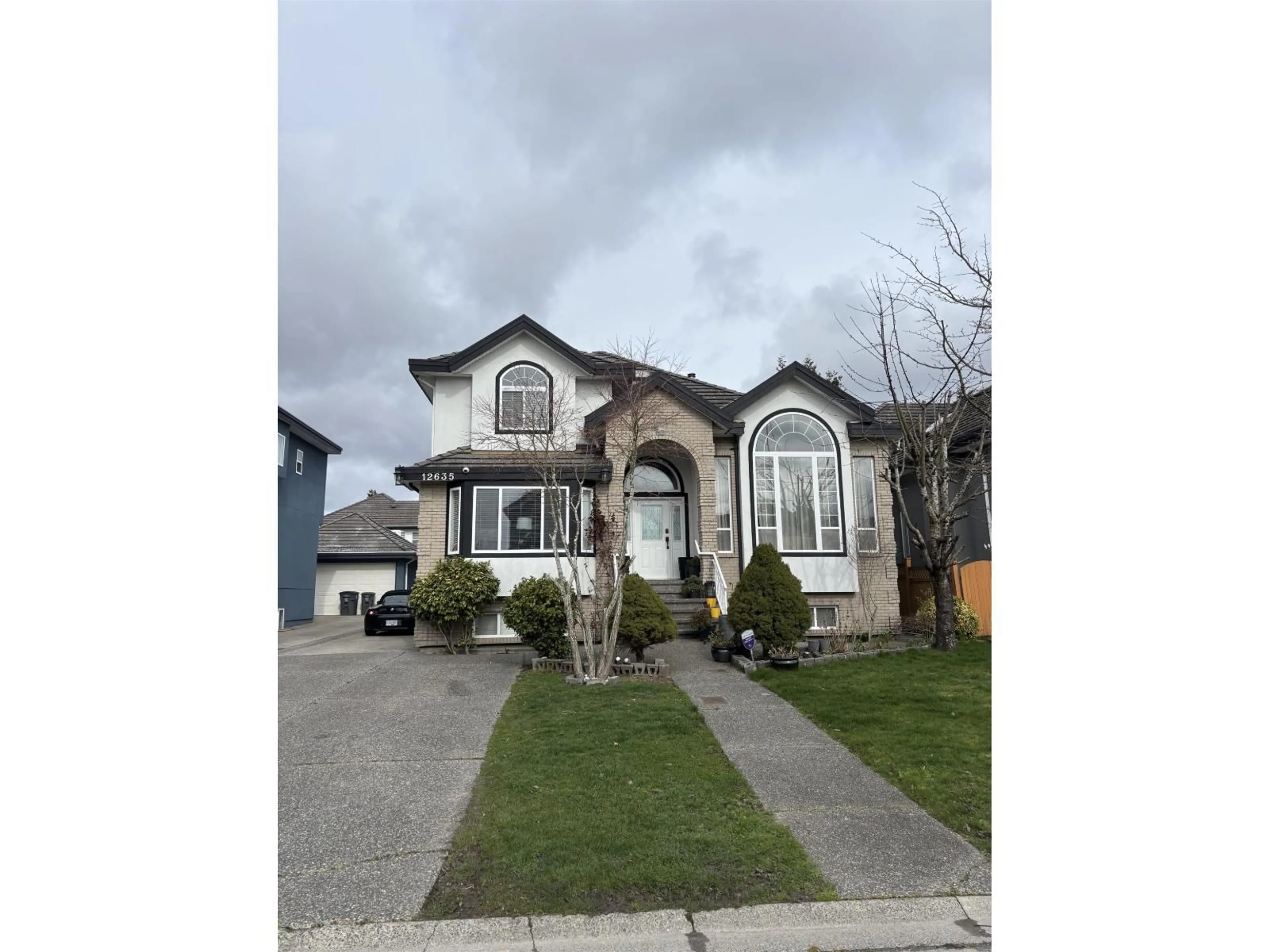 Home with vinyl exterior material, street for 12635 67A AVENUE, Surrey British Columbia V3W1G3