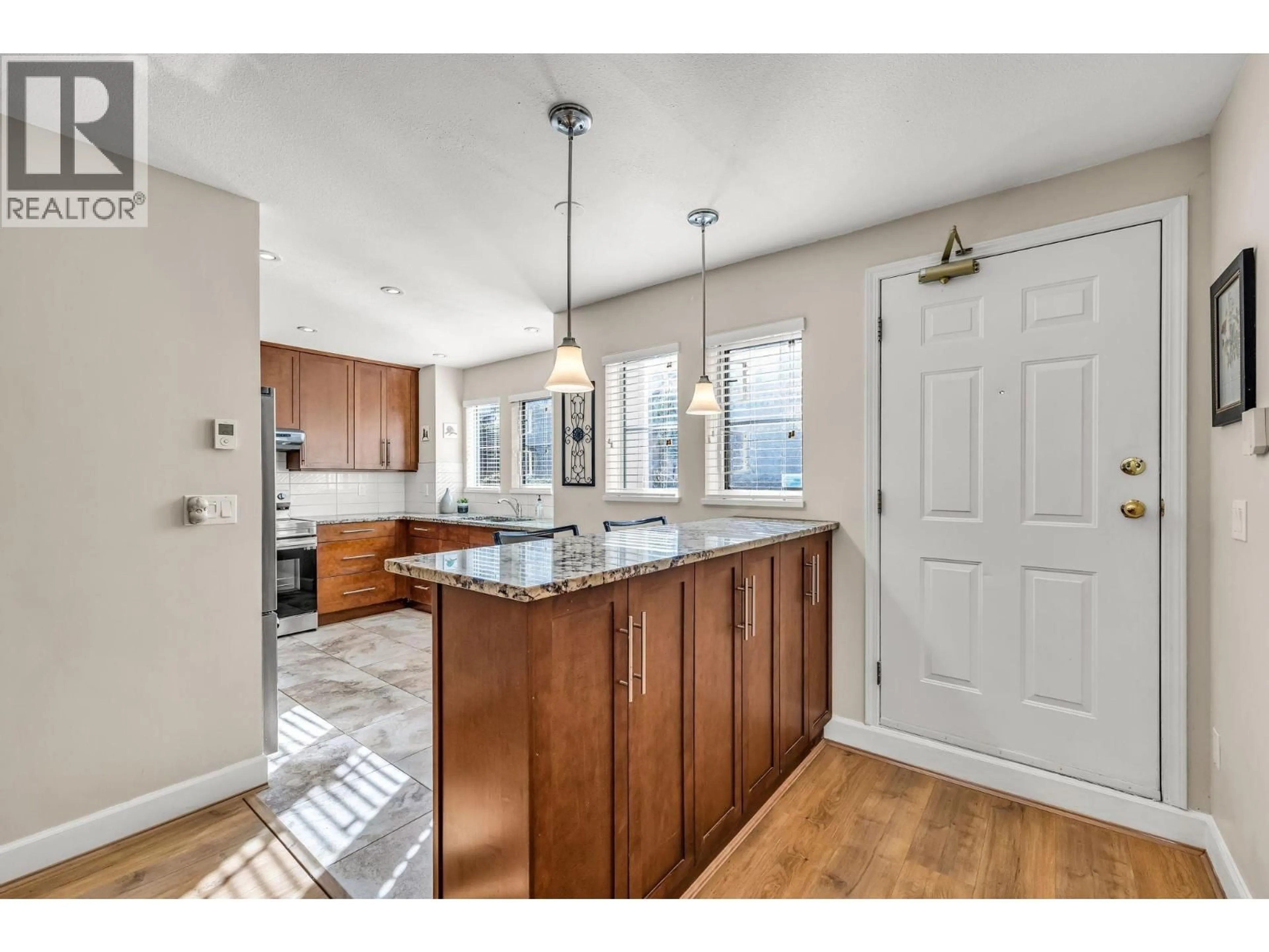 Open concept kitchen, unknown for 103 - 245 15TH STREET, North Vancouver British Columbia V7M1S3
