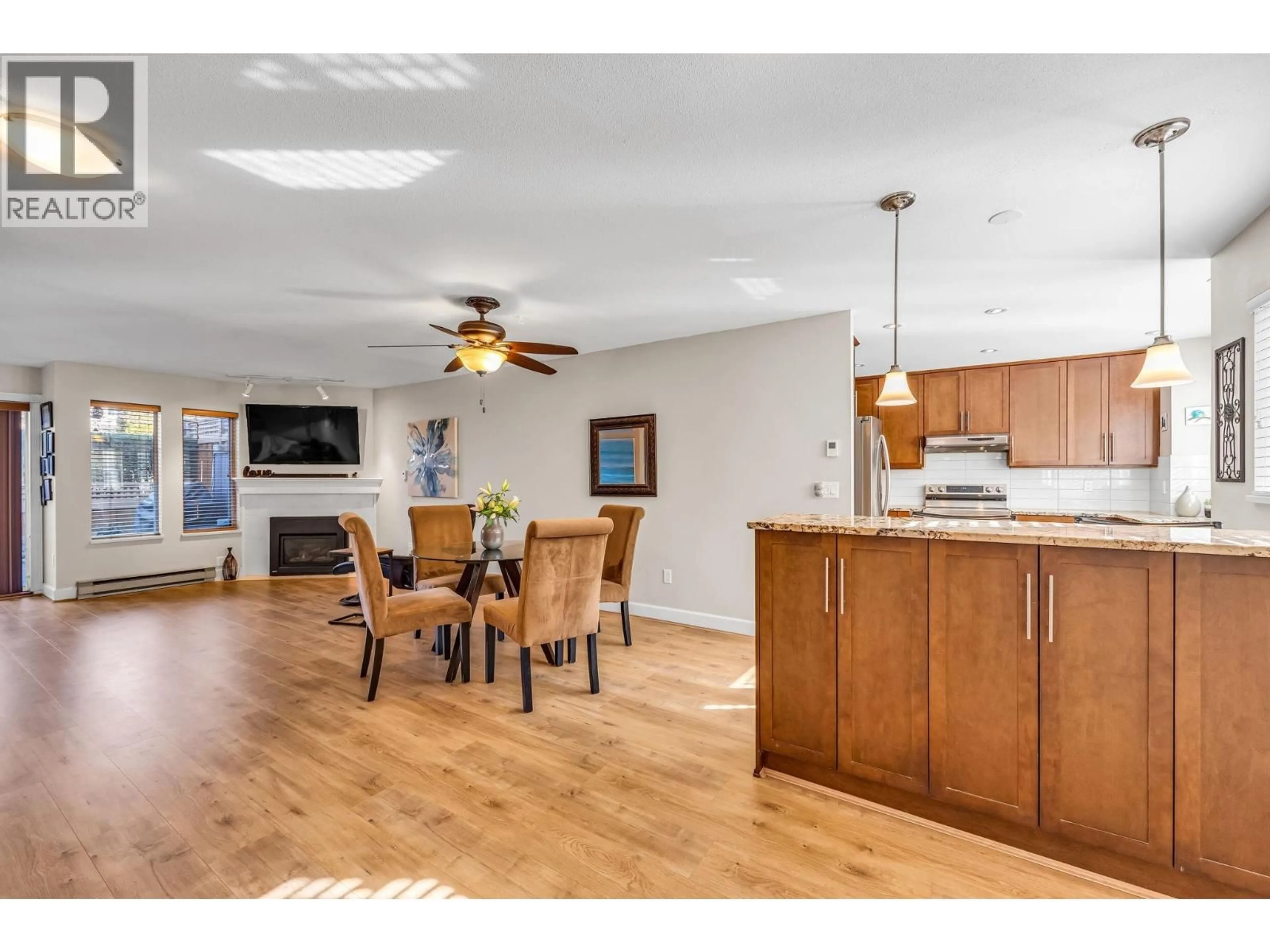 Open concept kitchen, wood/laminate floor for 103 - 245 15TH STREET, North Vancouver British Columbia V7M1S3