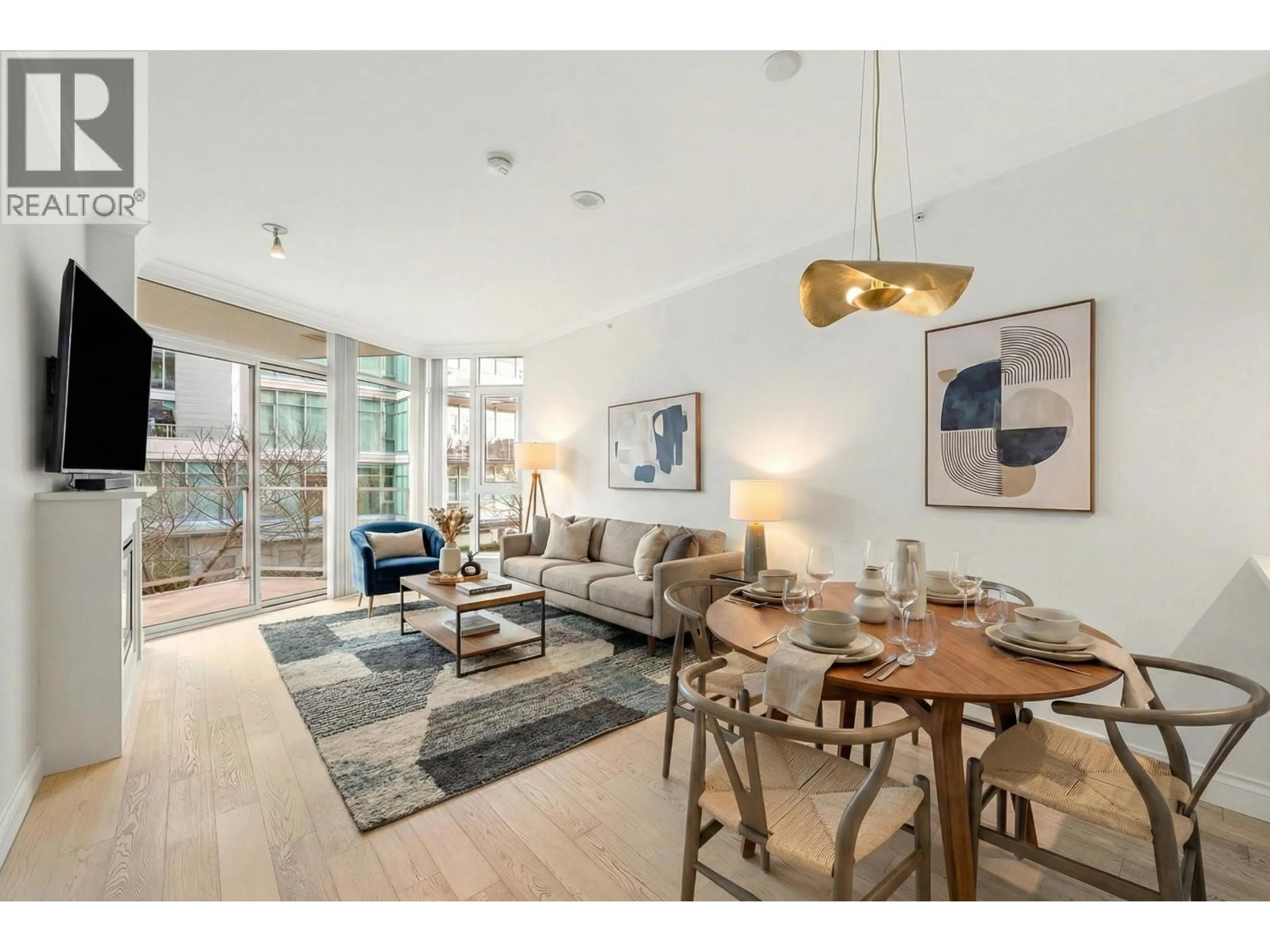 Living room with furniture, unknown for 208 - 199 VICTORY SHIP WAY, North Vancouver British Columbia V9L0E2