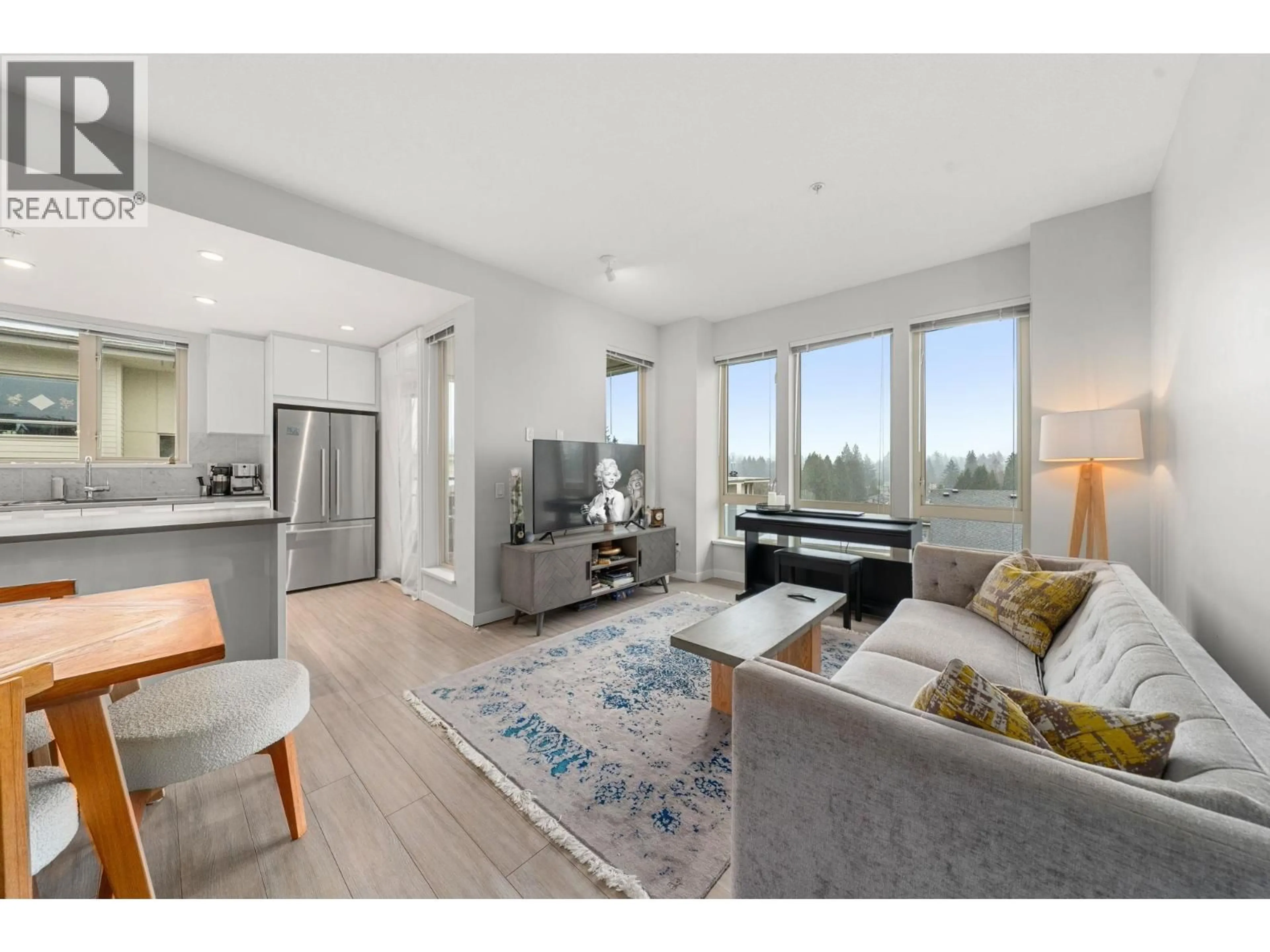 Living room with furniture, wood/laminate floor for 503 - 2632 LIBRARY LANE, North Vancouver British Columbia V7J0B8