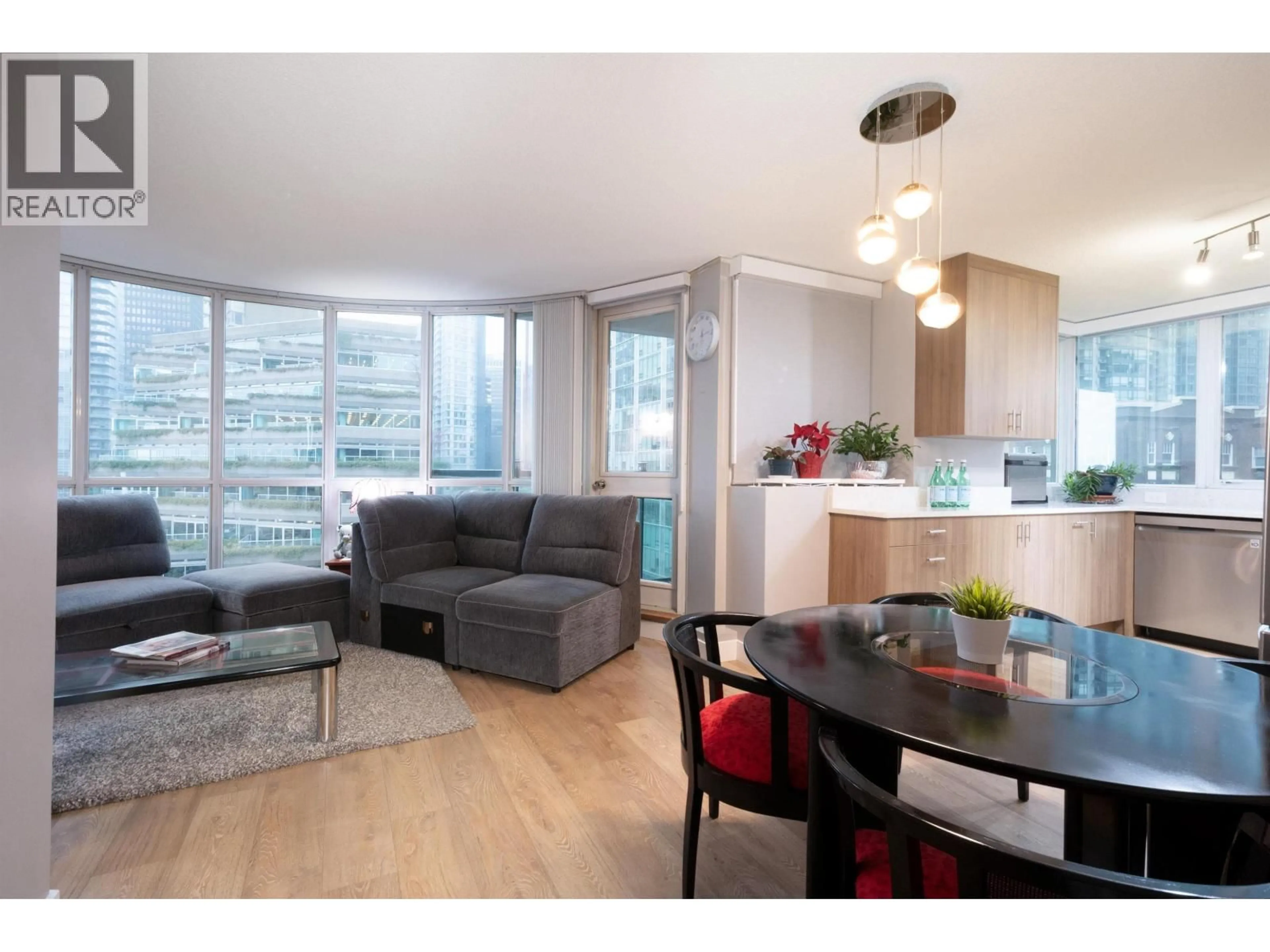 Living room with furniture, wood/laminate floor for 806 - 555 JERVIS STREET, Vancouver British Columbia V6E4N1