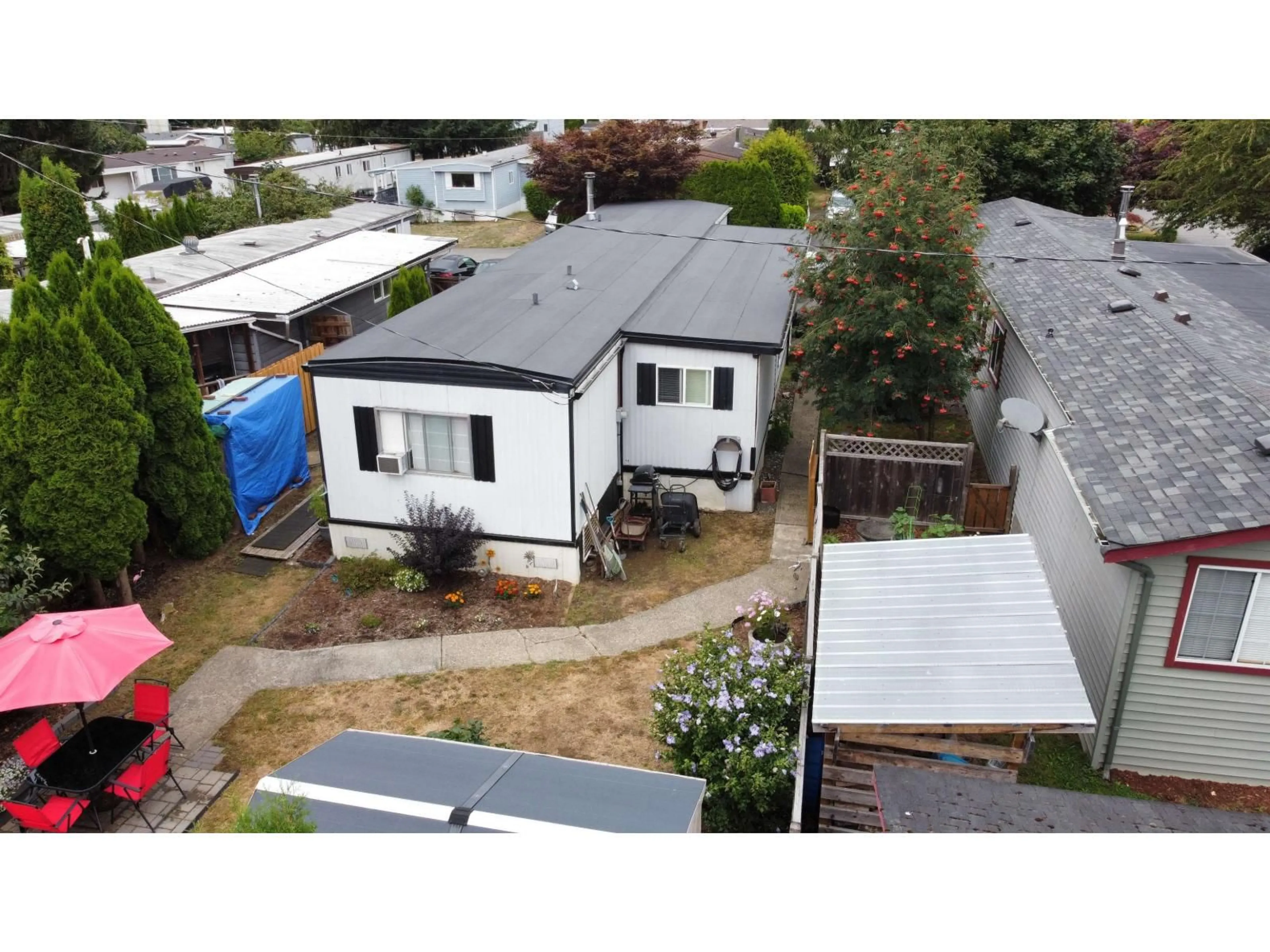 A pic from outside/outdoor area/front of a property/back of a property/a pic from drone, street for 30 - 46484 CHILLIWACK LAKE ROAD, Chilliwack British Columbia V2R3R7