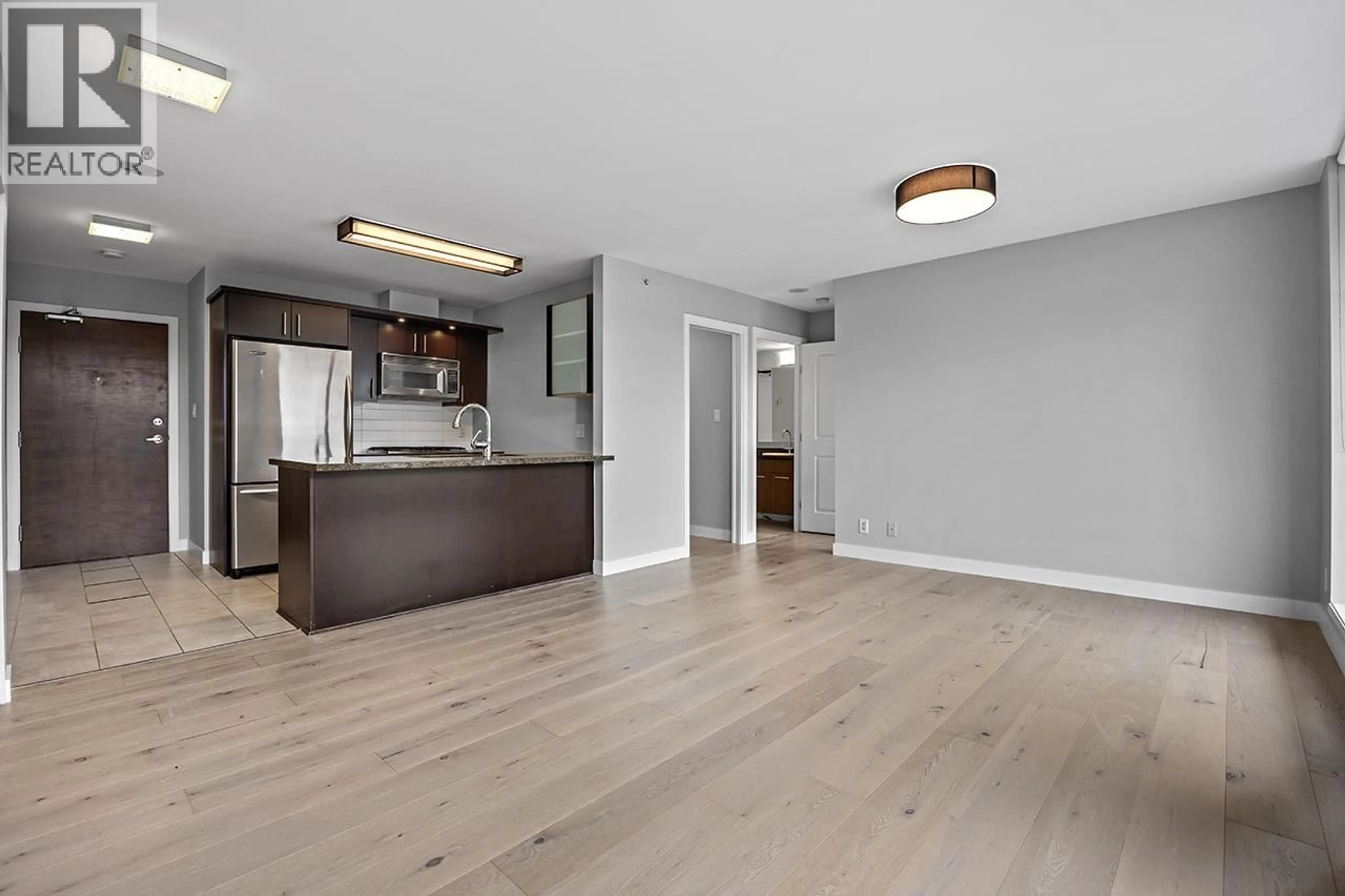 Open concept kitchen, wood/laminate floor for 404 - 1650 7TH AVENUE, Vancouver British Columbia V6J5N1