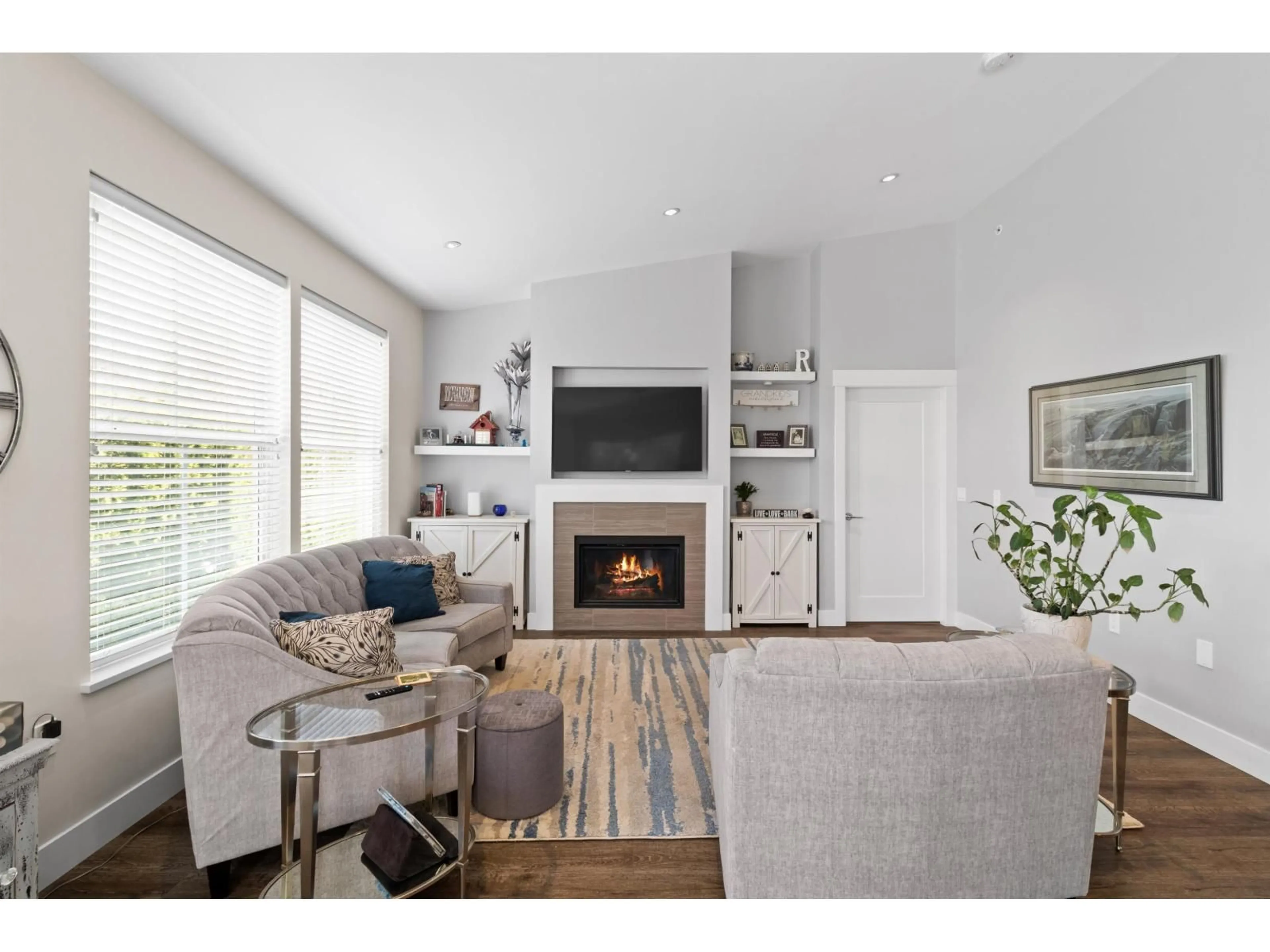 Living room with furniture, wood/laminate floor for 48 - 22057 49 AVENUE, Langley British Columbia V3A0J4