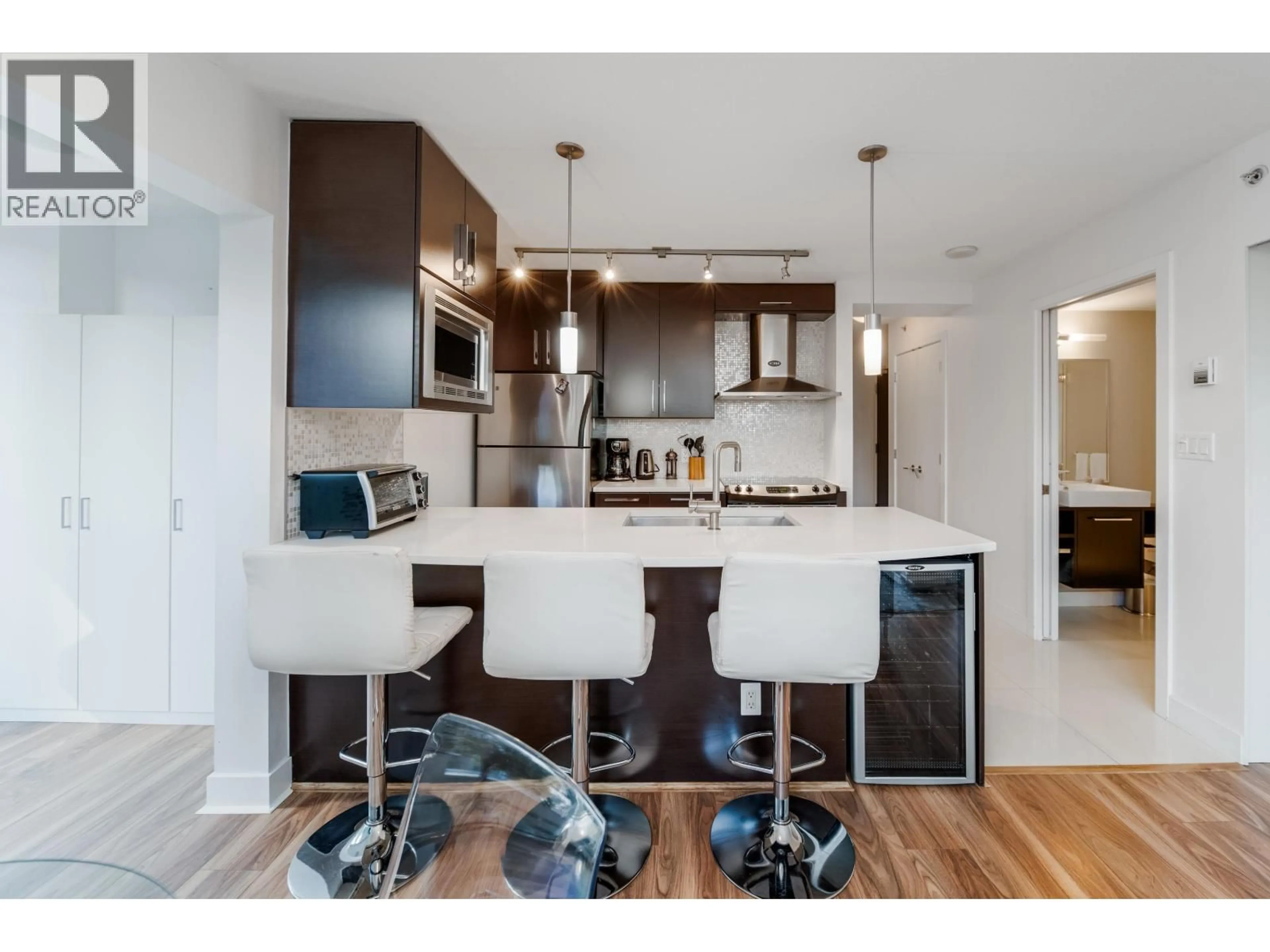 Open concept kitchen, wood/laminate floor for 301 - 689 ABBOTT STREET, Vancouver British Columbia V6B0J2