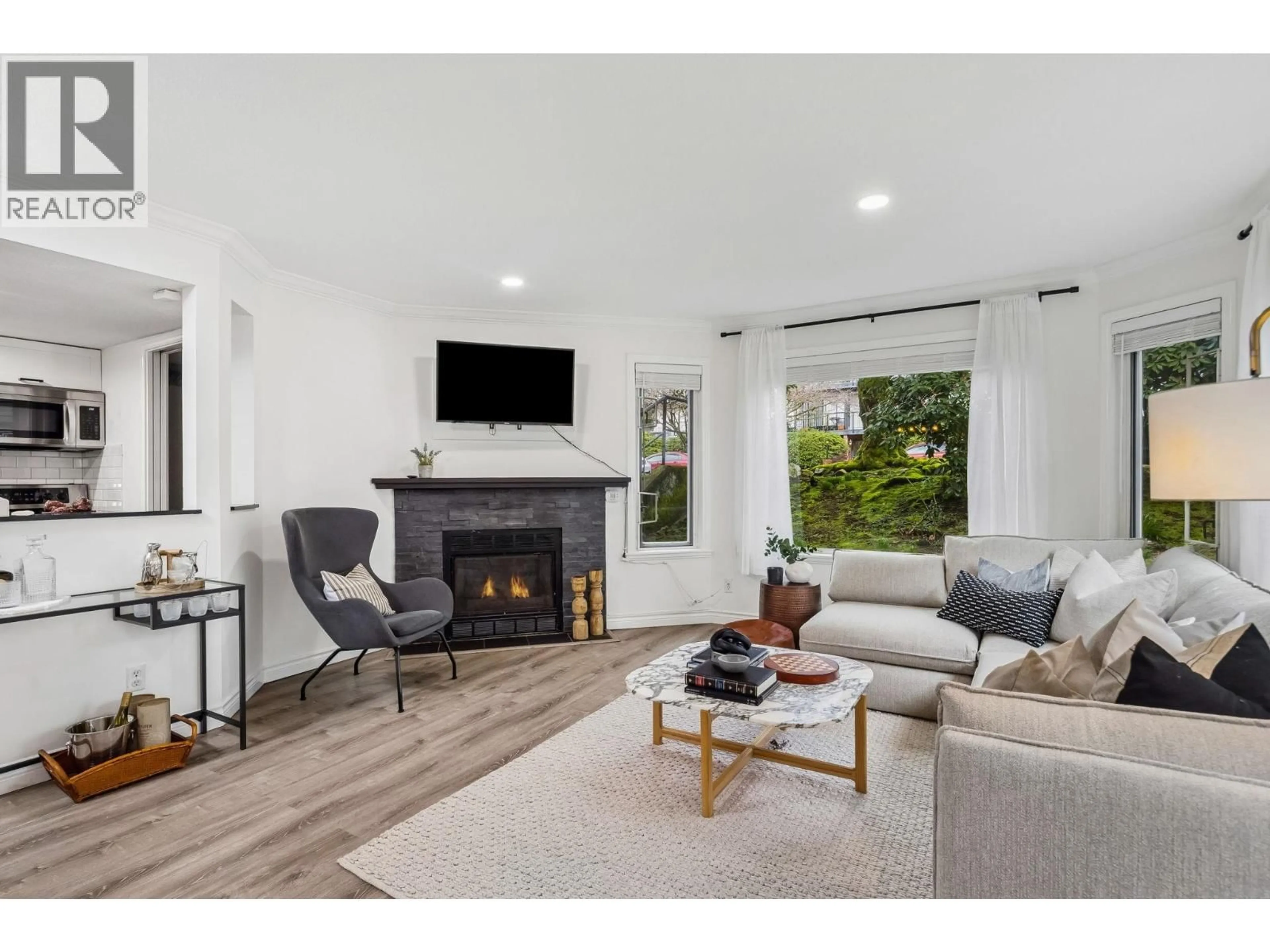 Living room with furniture, unknown for 107 - 175 4TH STREET, North Vancouver British Columbia V7M1H6