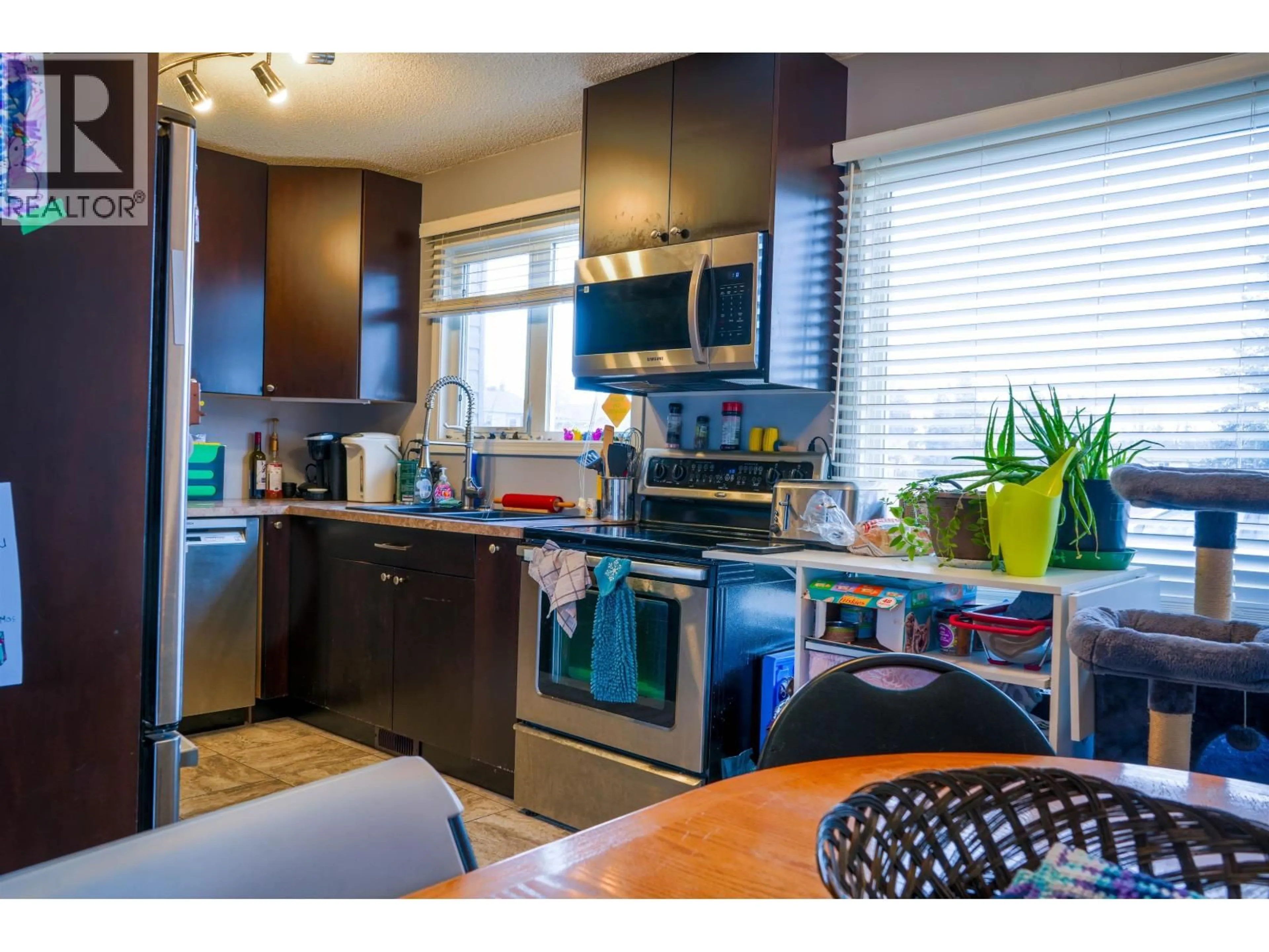 Open concept kitchen, wood/laminate floor for 307 - 2550 OSPIKA BOULEVARD, Prince George British Columbia V2N3T2