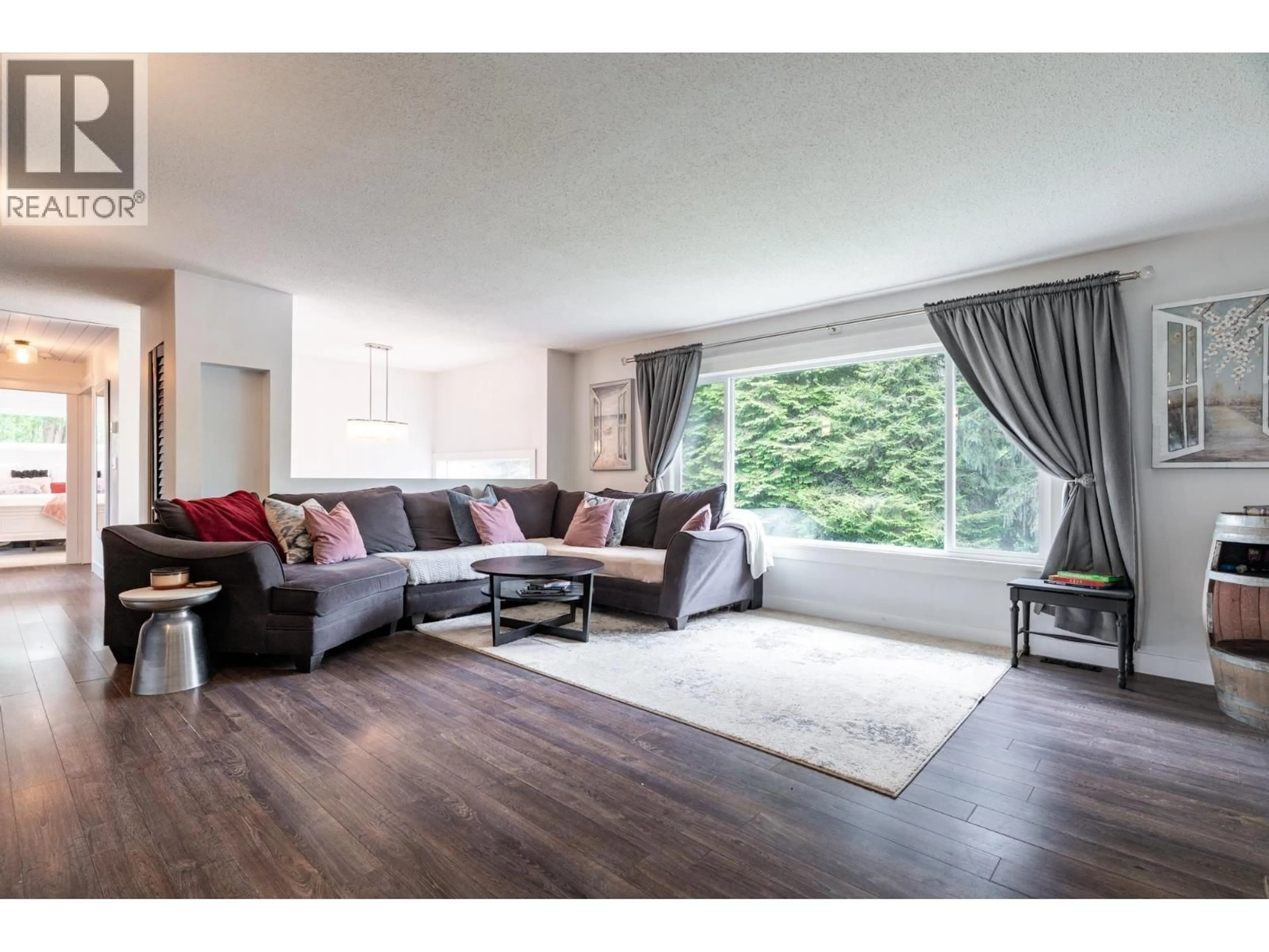 Living room with furniture, wood/laminate floor for 24991 100 AVENUE, Maple Ridge British Columbia V2W1S3