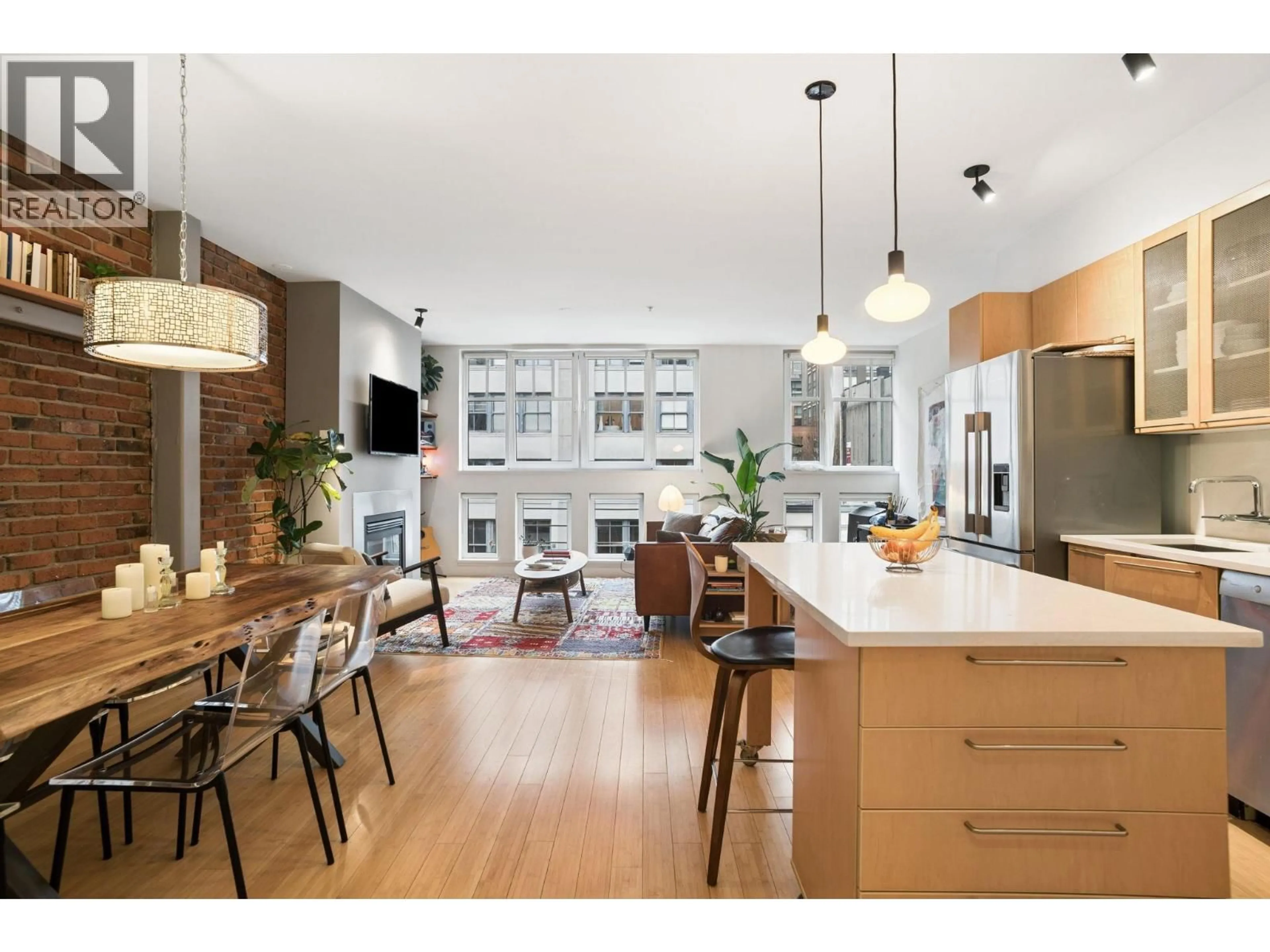 Open concept kitchen, wood/laminate floor for 401 - 1072 HAMILTON STREET, Vancouver British Columbia V6B2R9
