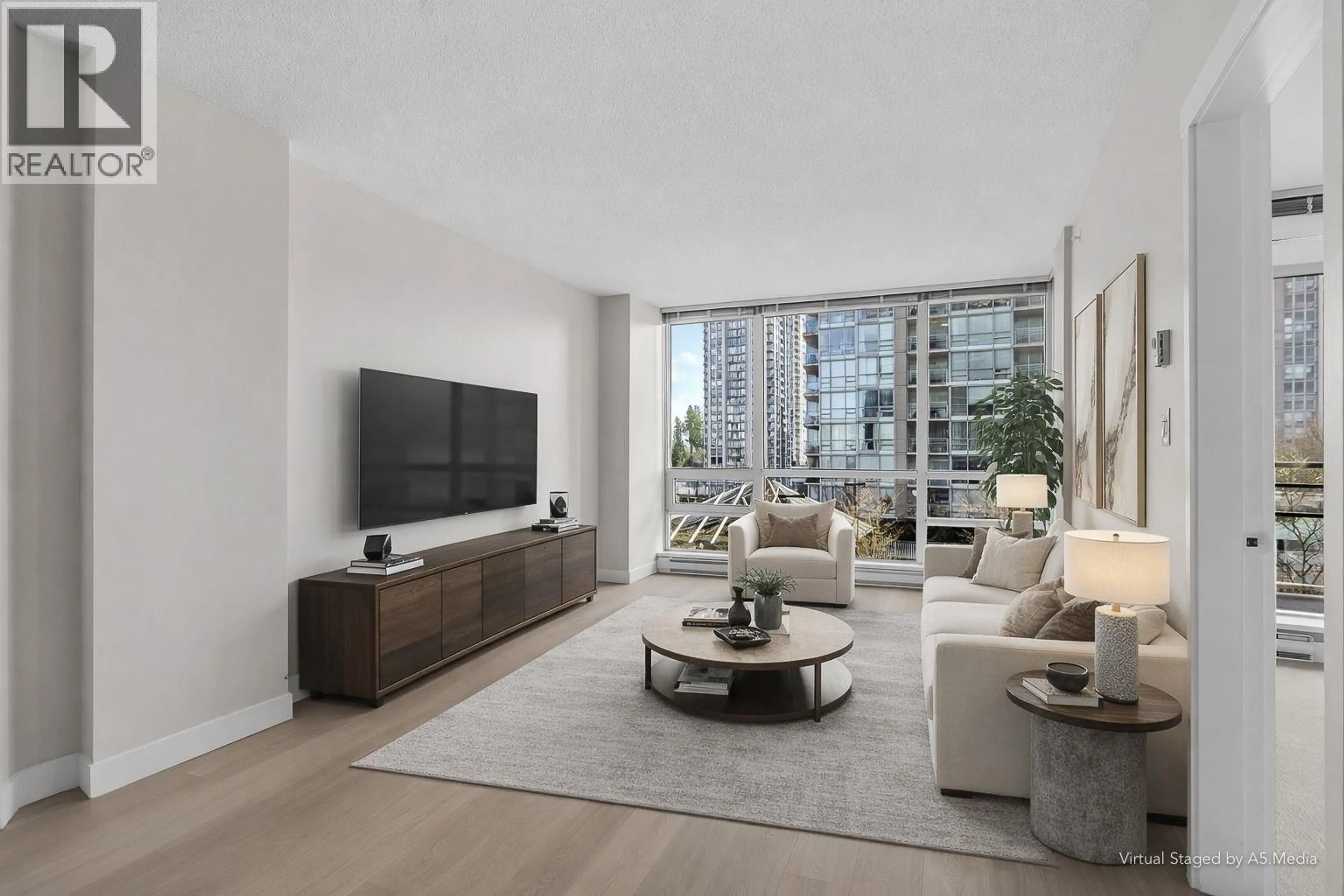 Living room with furniture, floor is not visible for 706 - 2968 GLEN DRIVE, Coquitlam British Columbia V3B0C4