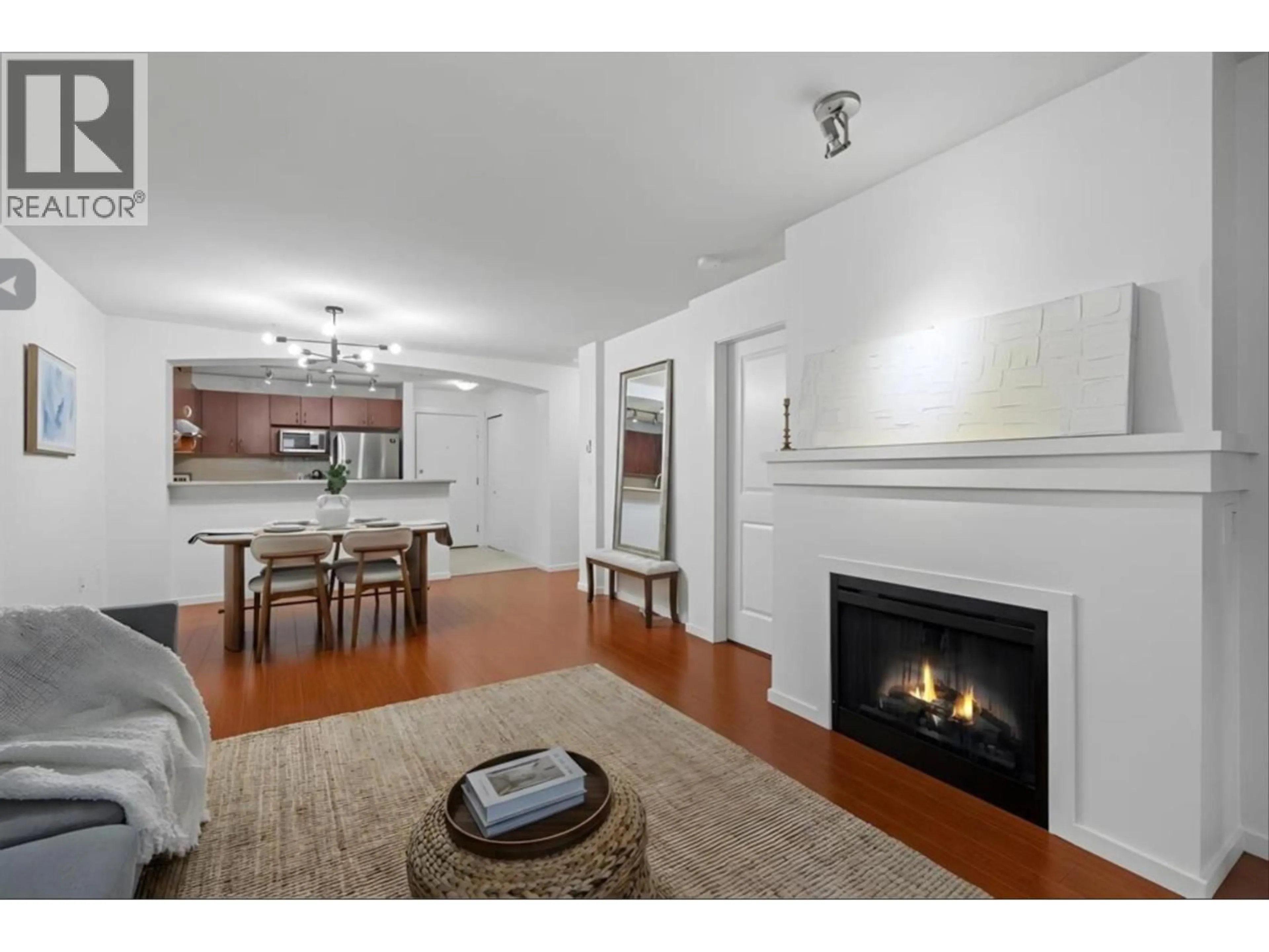 Living room with furniture, wood/laminate floor for 303 - 9098 HALSTON COURT, Burnaby British Columbia V3N0A6