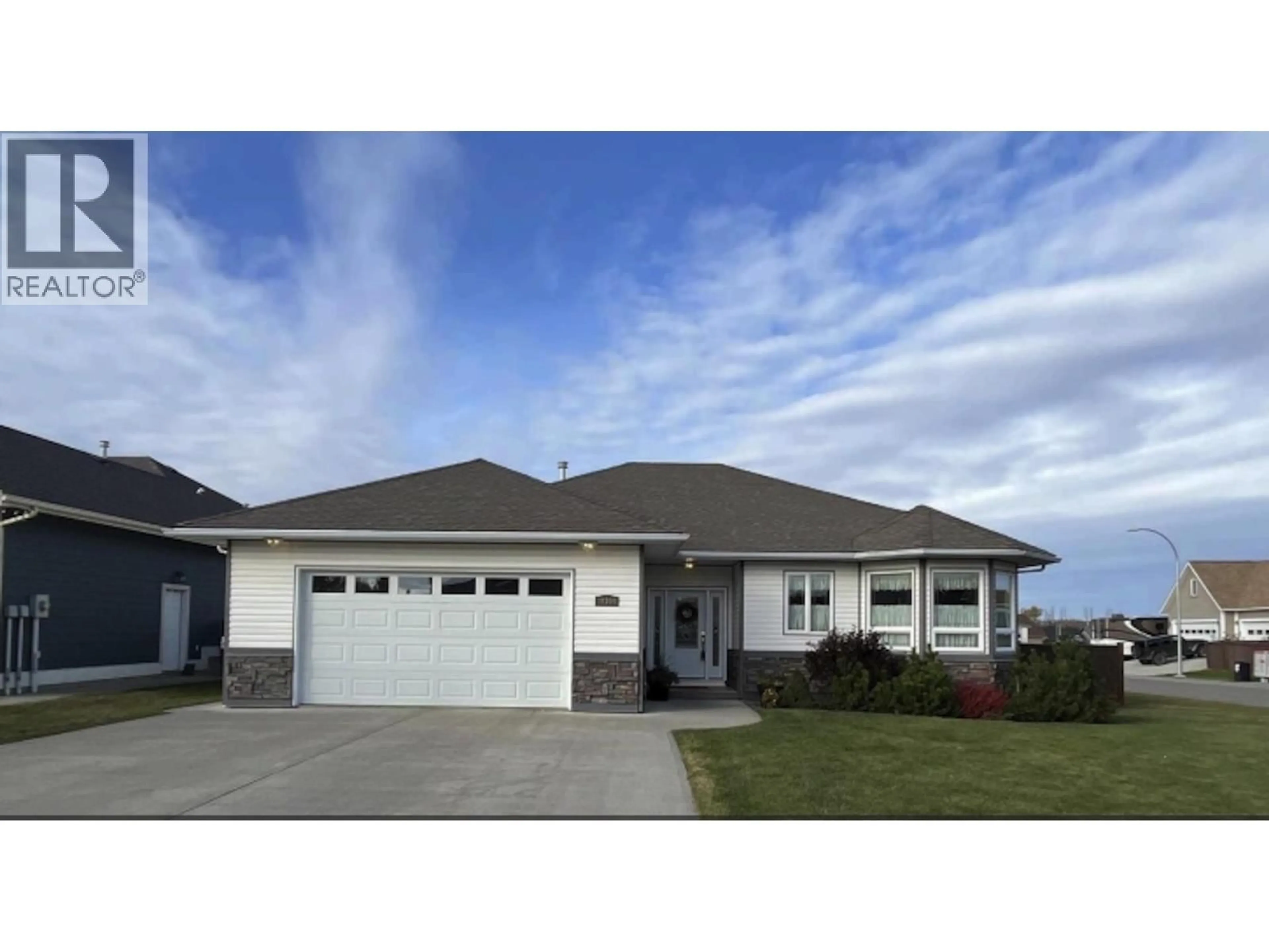 Home with vinyl exterior material, street for 10304 114A AVENUE, Fort St. John British Columbia V1J7J2
