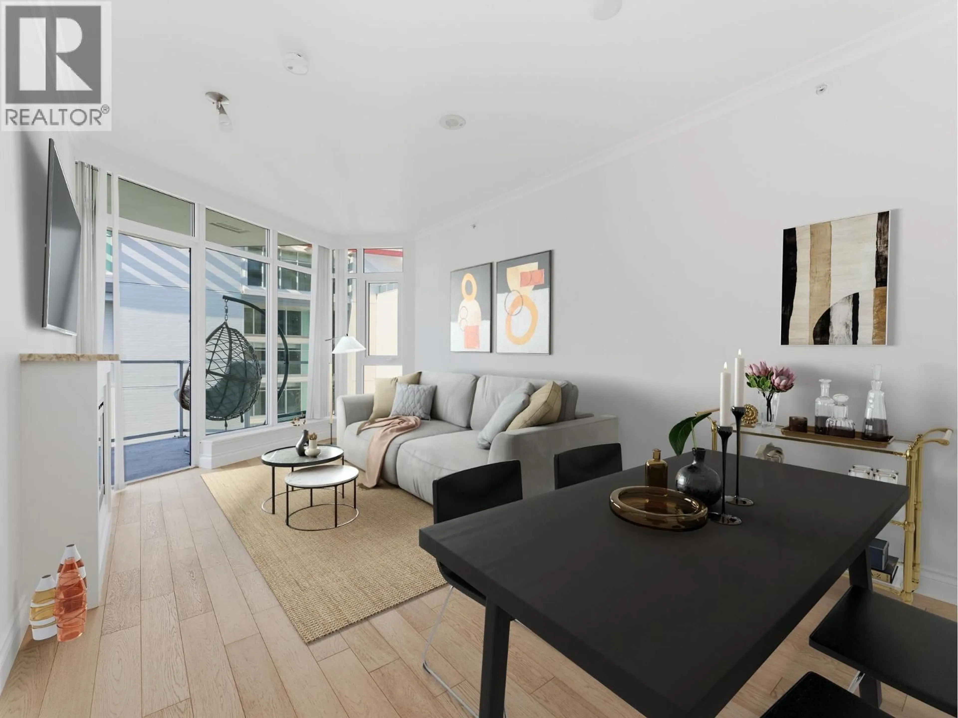 Living room with furniture, wood/laminate floor for 706 - 199 VICTORY SHIP WAY, North Vancouver British Columbia V7L0B2