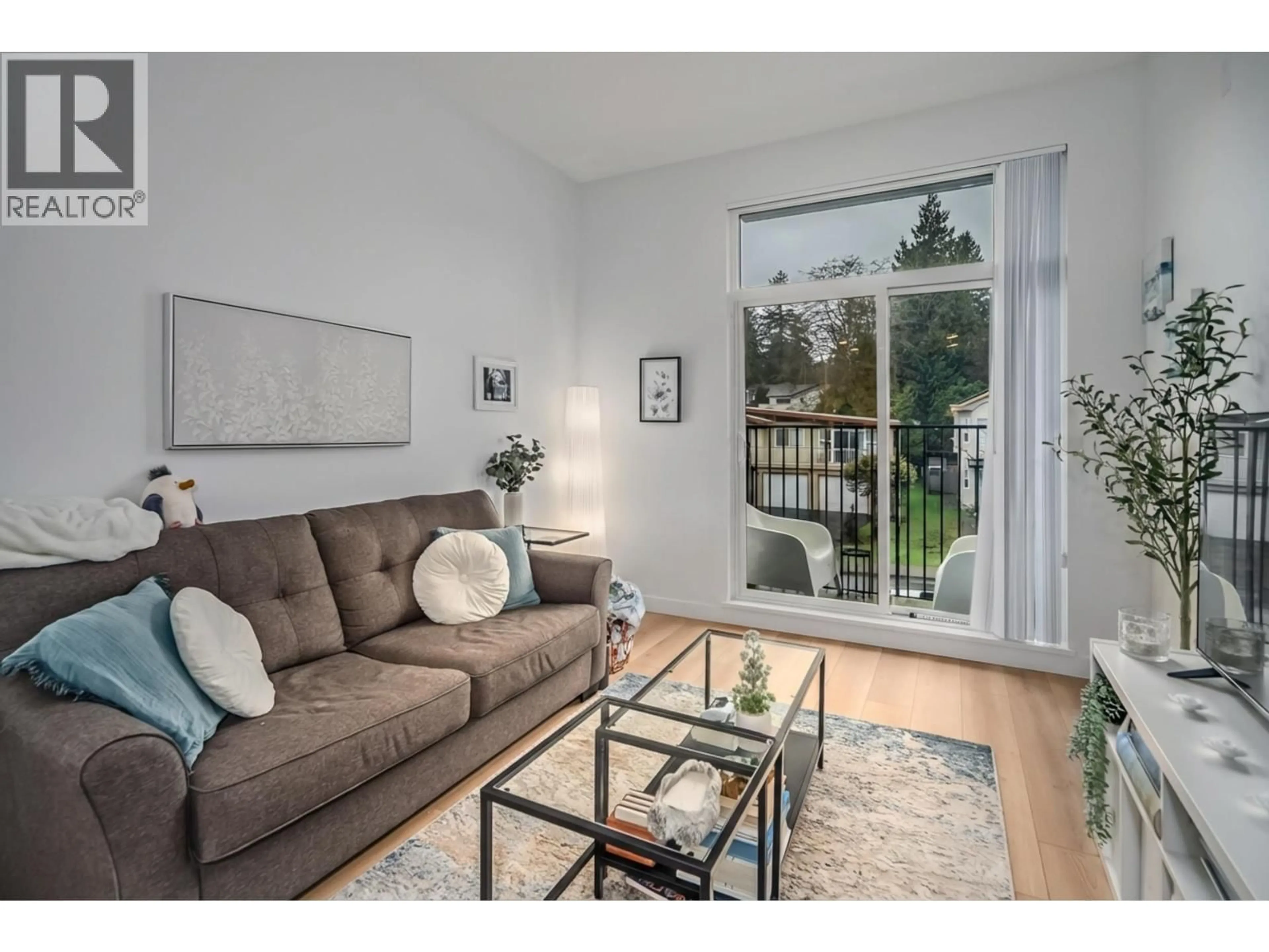 Living room with furniture, wood/laminate floor for 213 - 708 EDGAR AVENUE, Coquitlam British Columbia V3K0H3