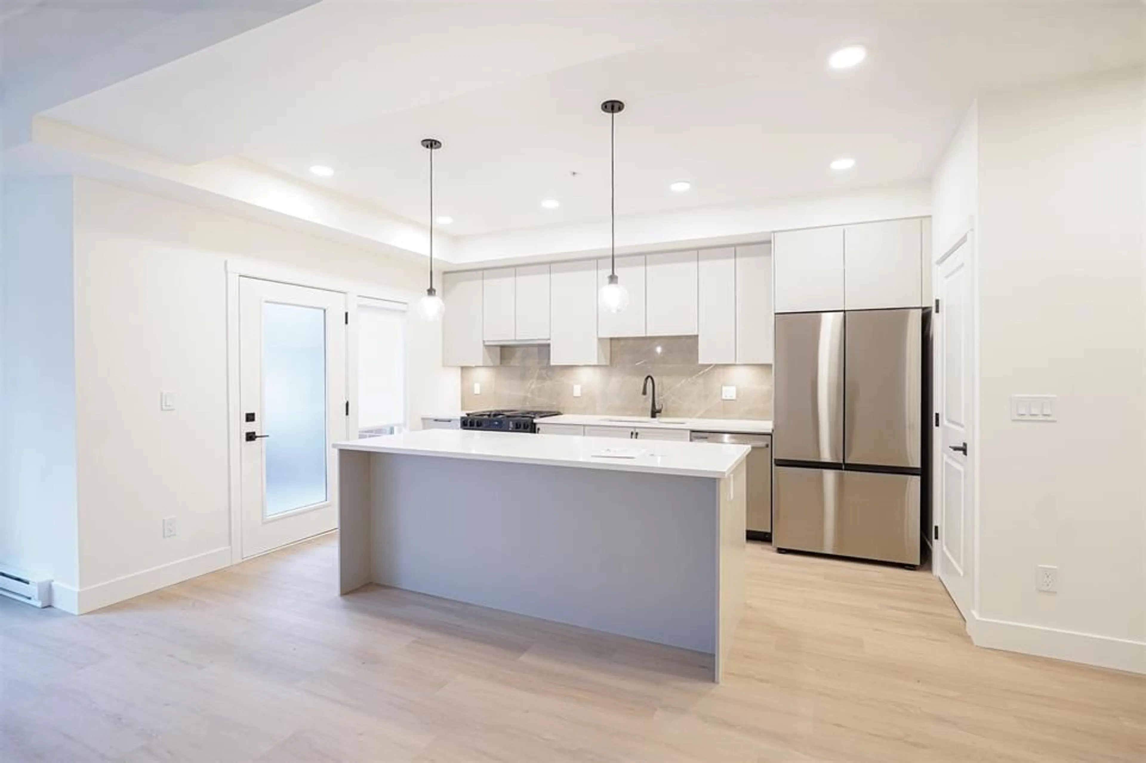 Open concept kitchen, unknown for 102 - 3528 146A STREET, Surrey British Columbia V4P0H4