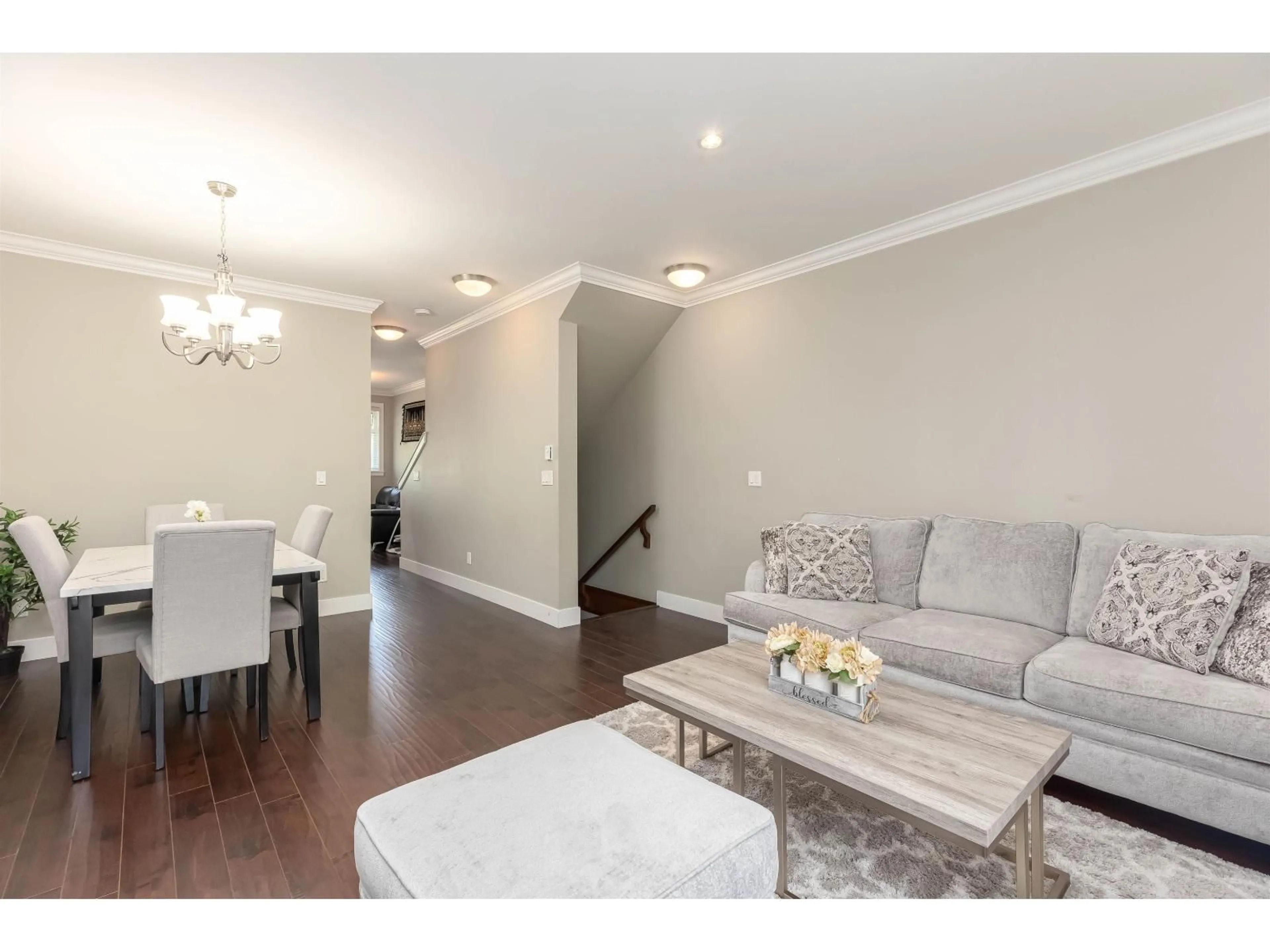 Living room with furniture, wood/laminate floor for 64 - 6383 140 STREET, Surrey British Columbia V3W0E9