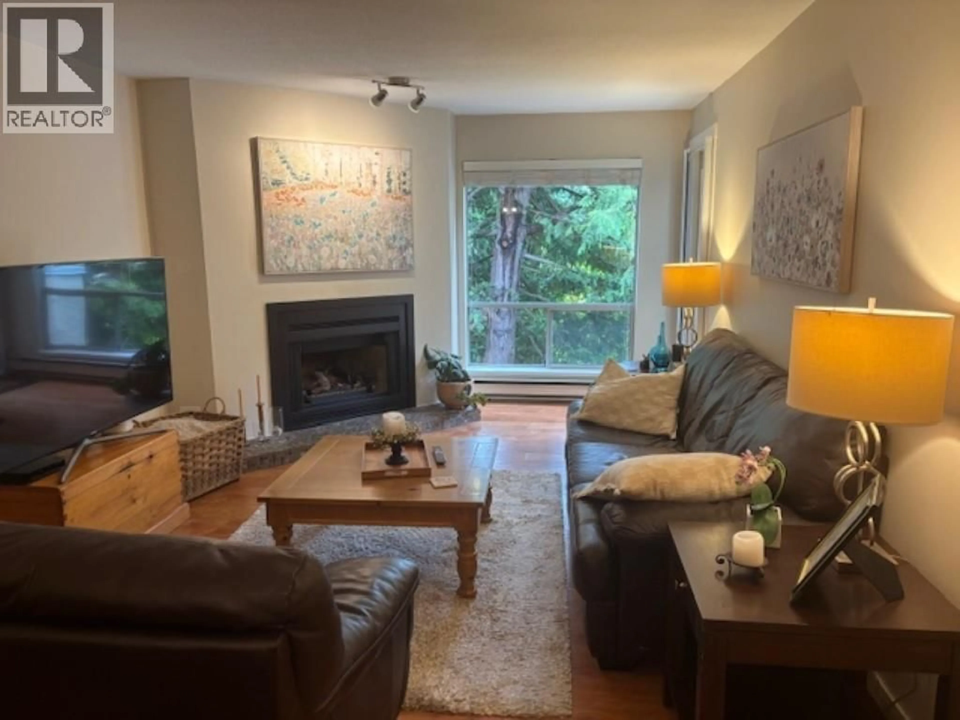 Living room with furniture, wood/laminate floor for 327 - 1441 GARDEN PLACE, Delta British Columbia V4M3Z2
