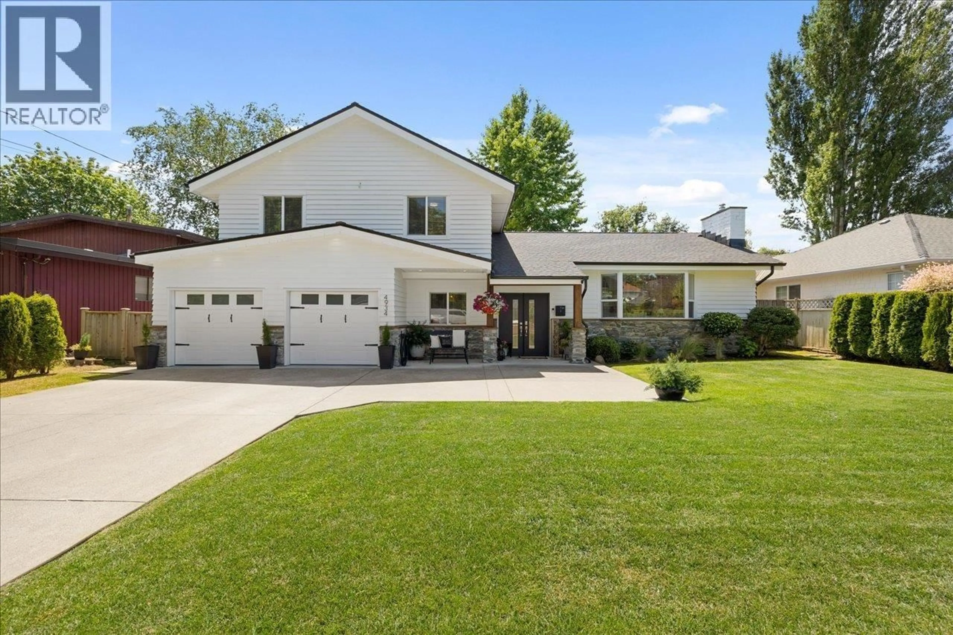 Home with vinyl exterior material, street for 4934 12 AVENUE, Delta British Columbia V4M2A6