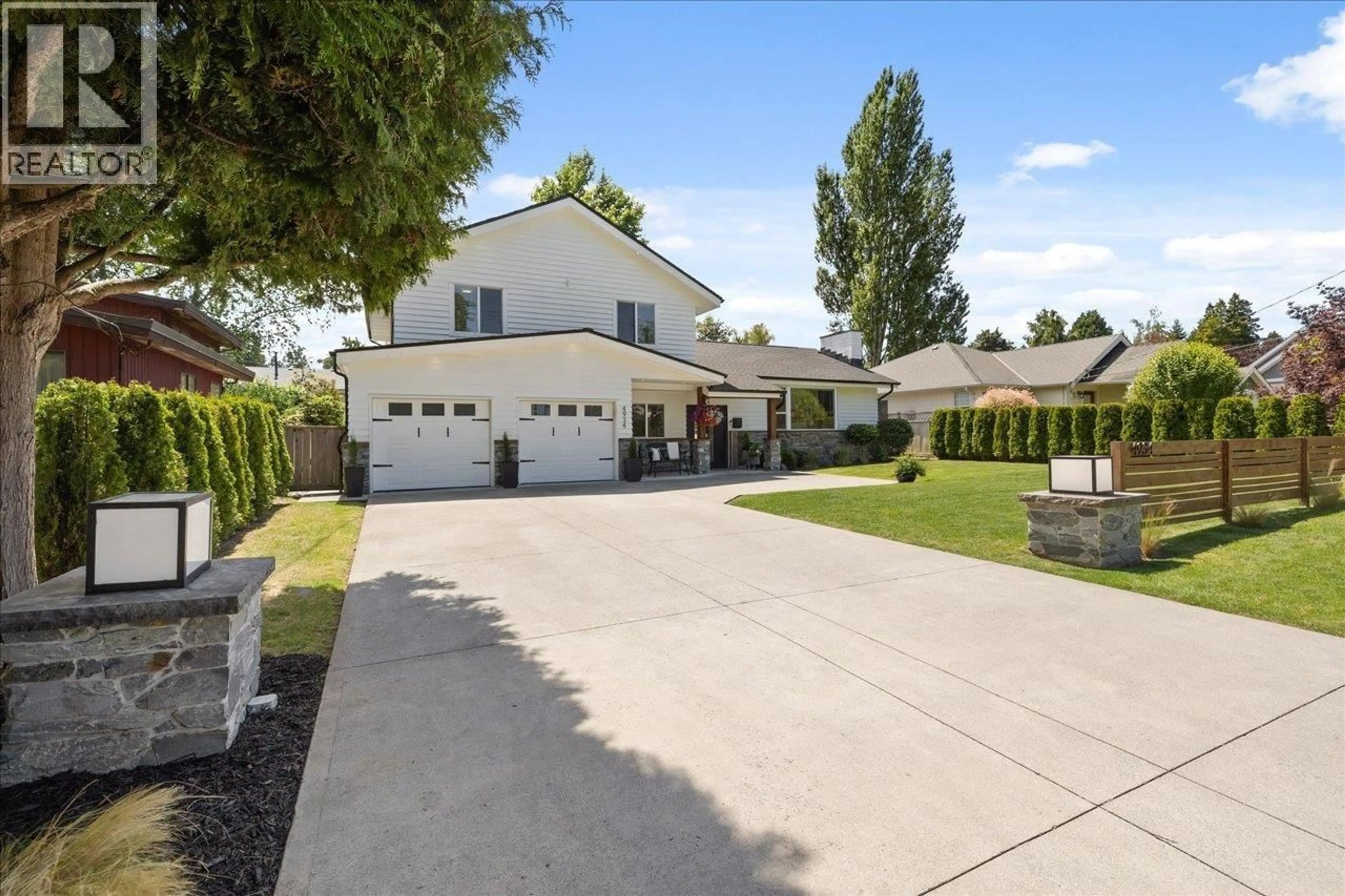 A pic from outside/outdoor area/front of a property/back of a property/a pic from drone, street for 4934 12 AVENUE, Delta British Columbia V4M2A6