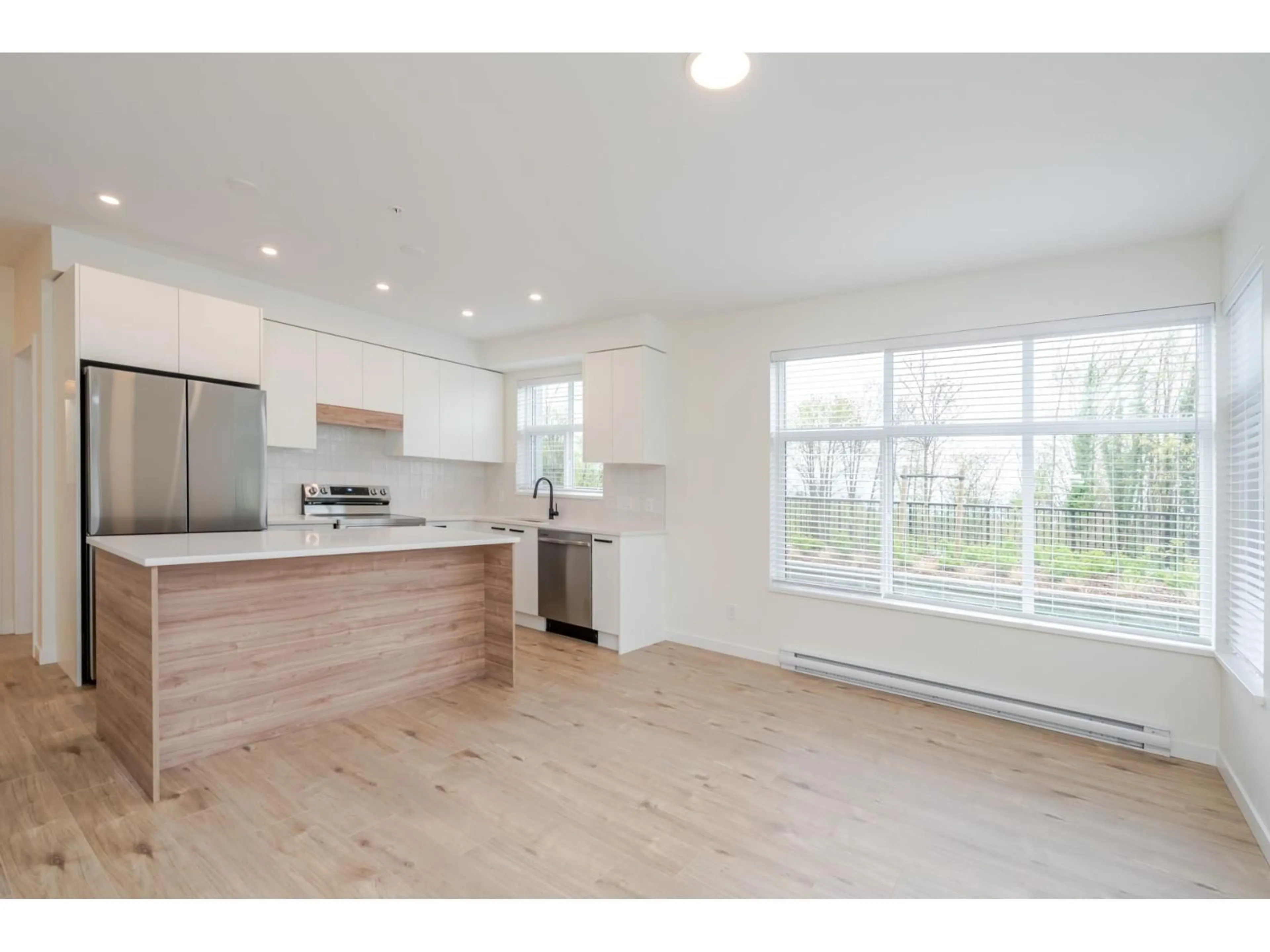 Open concept kitchen, wood/laminate floor for 106 - 33920 BEST STREET, Mission British Columbia V2V7A4