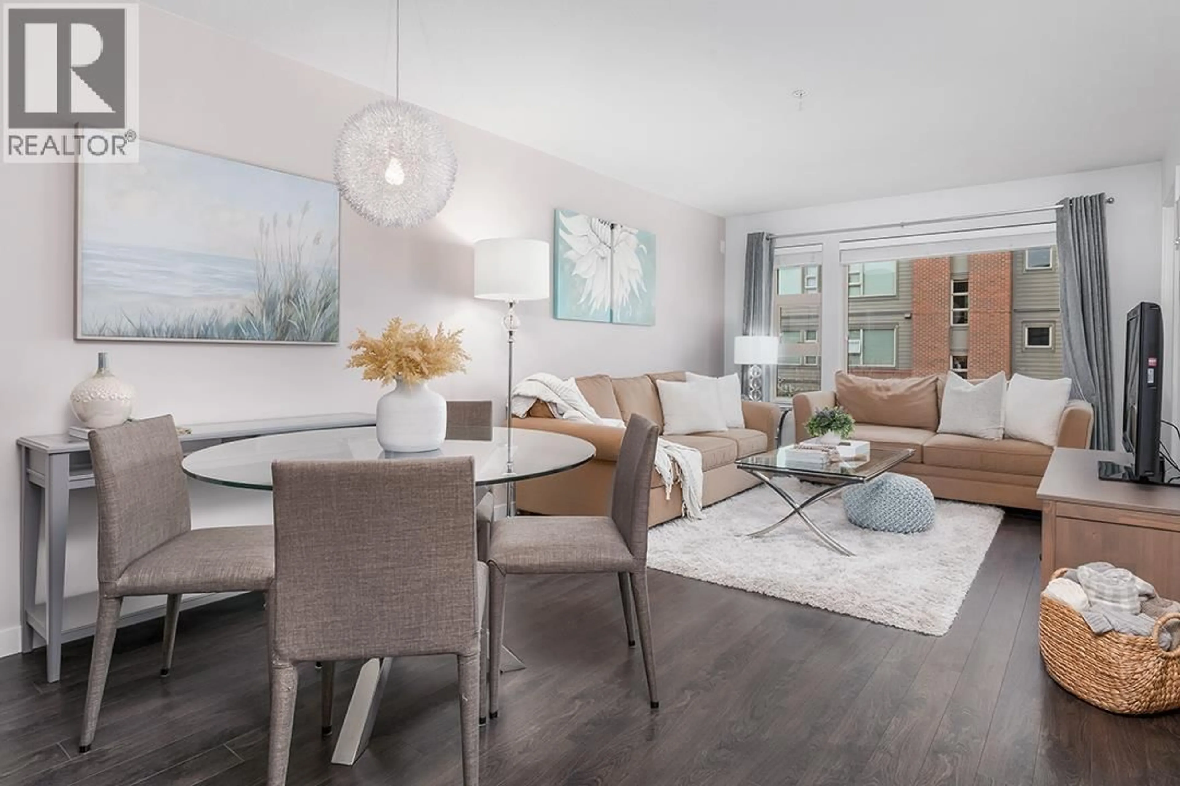 Living room with furniture, wood/laminate floor for 301 - 1673 LLOYD AVENUE, North Vancouver British Columbia V7P0A9