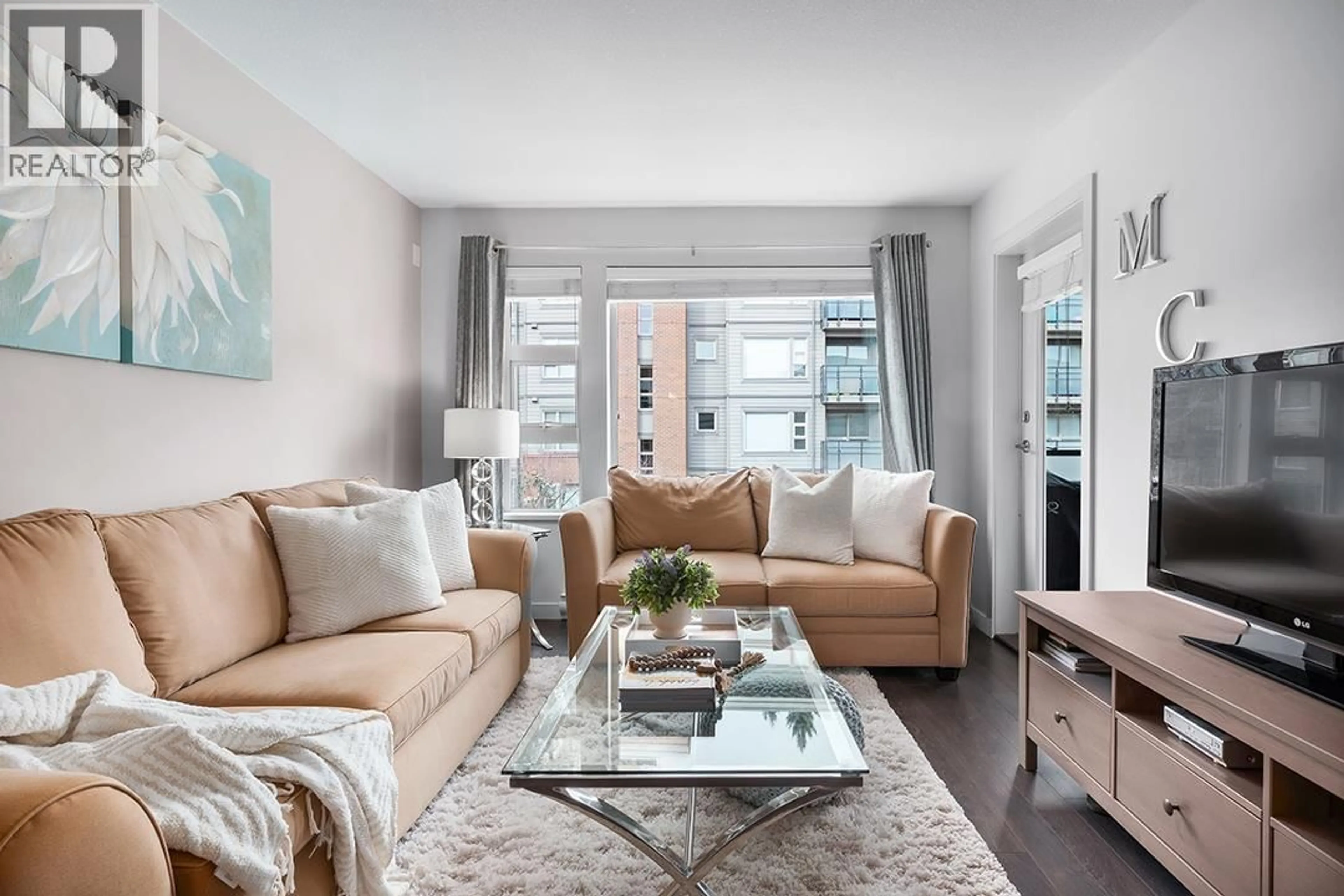 Living room with furniture, unknown for 301 - 1673 LLOYD AVENUE, North Vancouver British Columbia V7P0A9