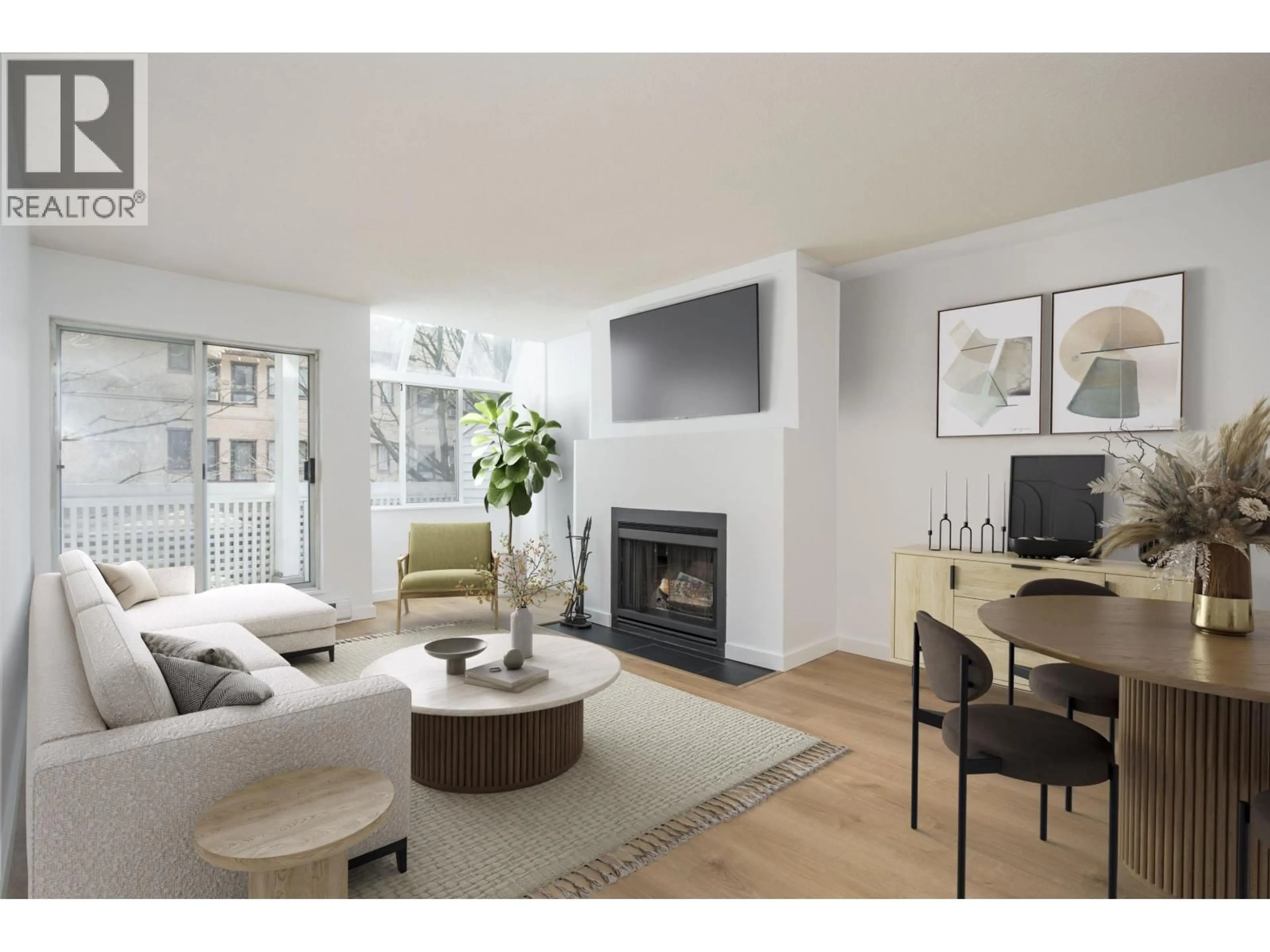 Living room with furniture, wood/laminate floor for 108 - 7471 BLUNDELL ROAD, Richmond British Columbia V6Y1J6