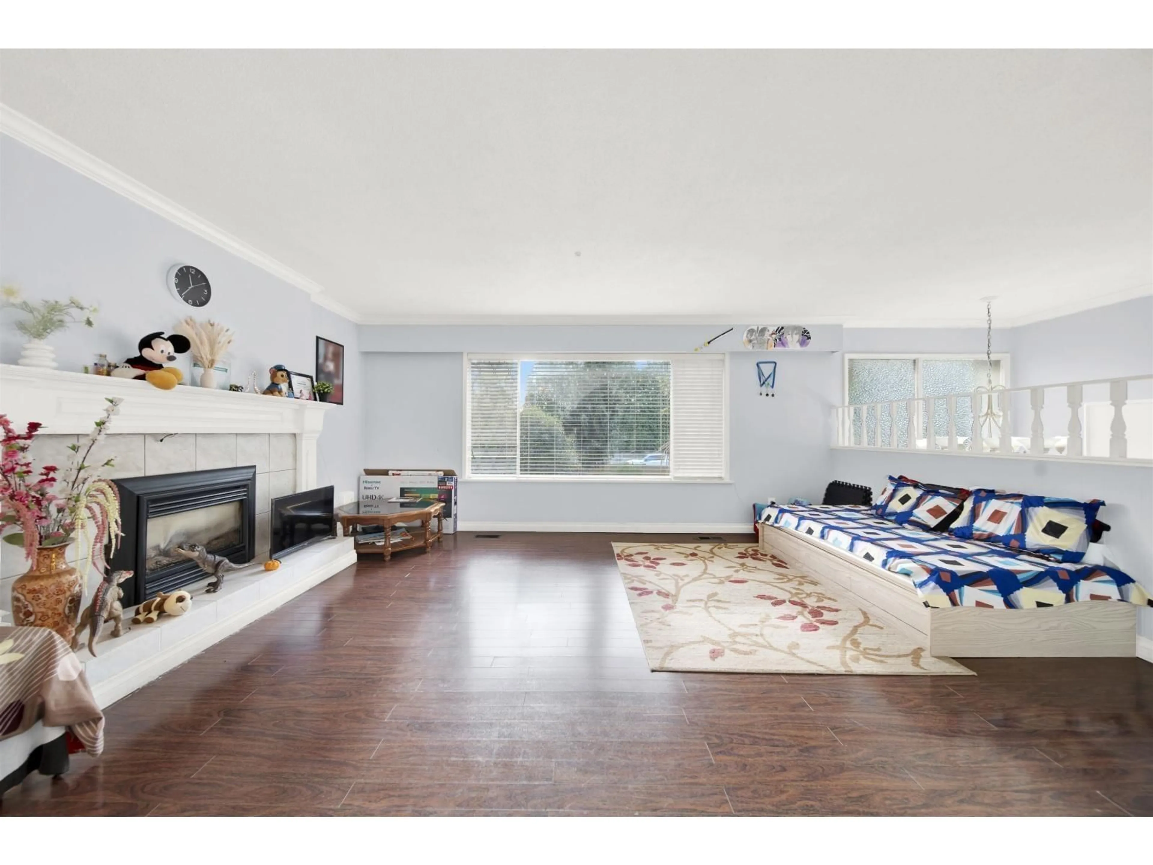 Living room with furniture, wood/laminate floor for 12627 58 AVENUE, Surrey British Columbia V3X2P5