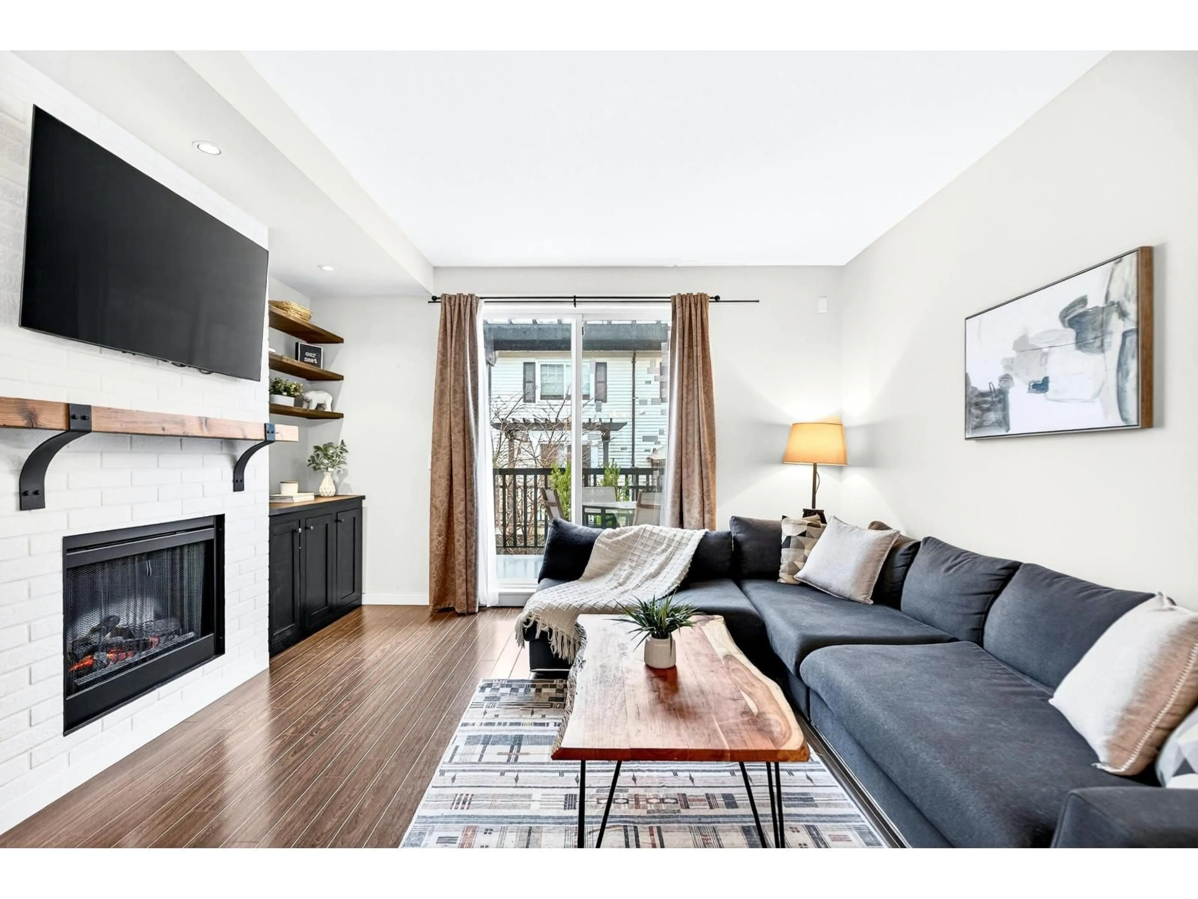 Living room with furniture, wood/laminate floor for 15 - 18983 72A AVENUE, Surrey British Columbia V4N1A5