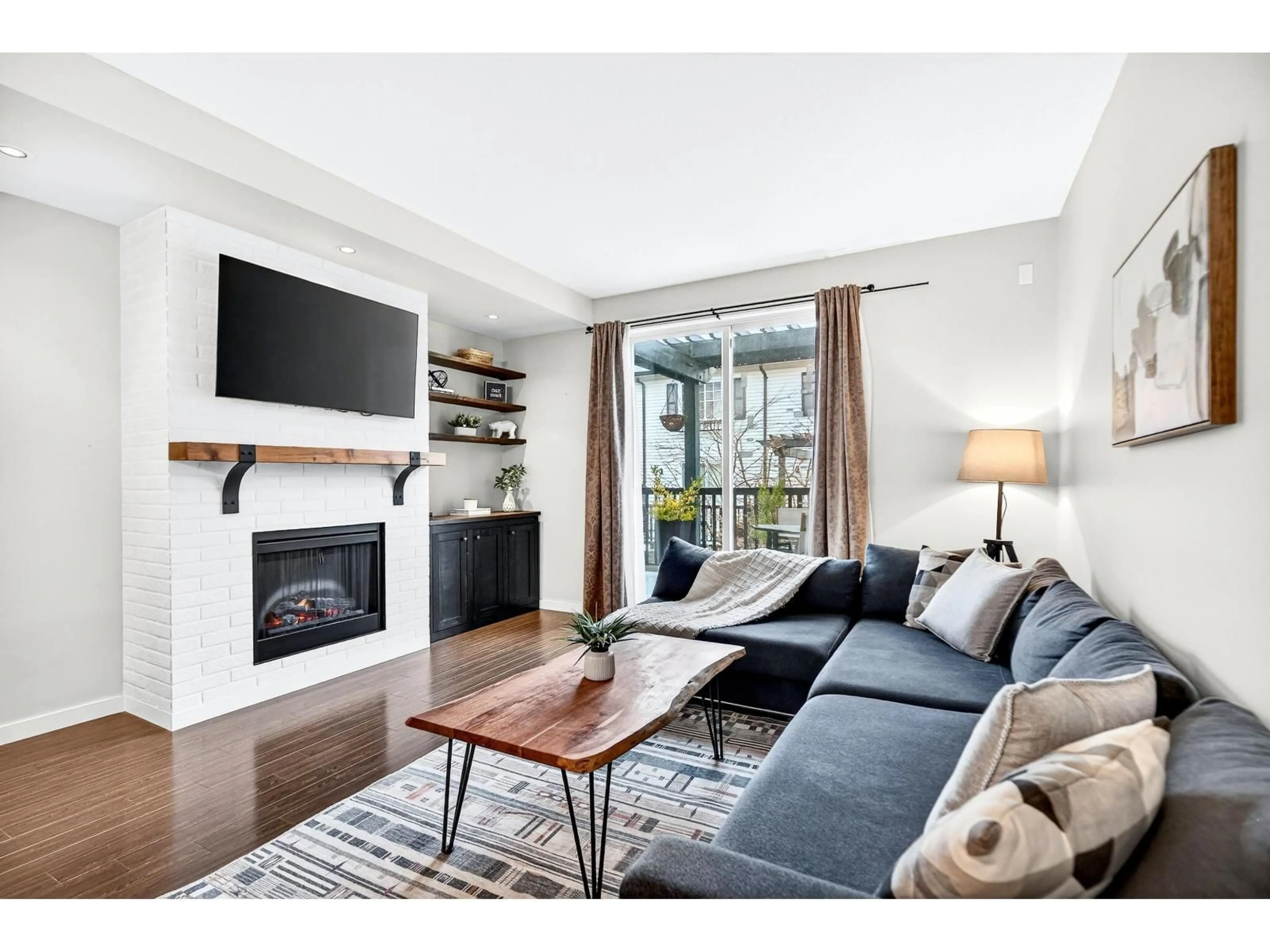 Living room with furniture, wood/laminate floor for 15 - 18983 72A AVENUE, Surrey British Columbia V4N1A5