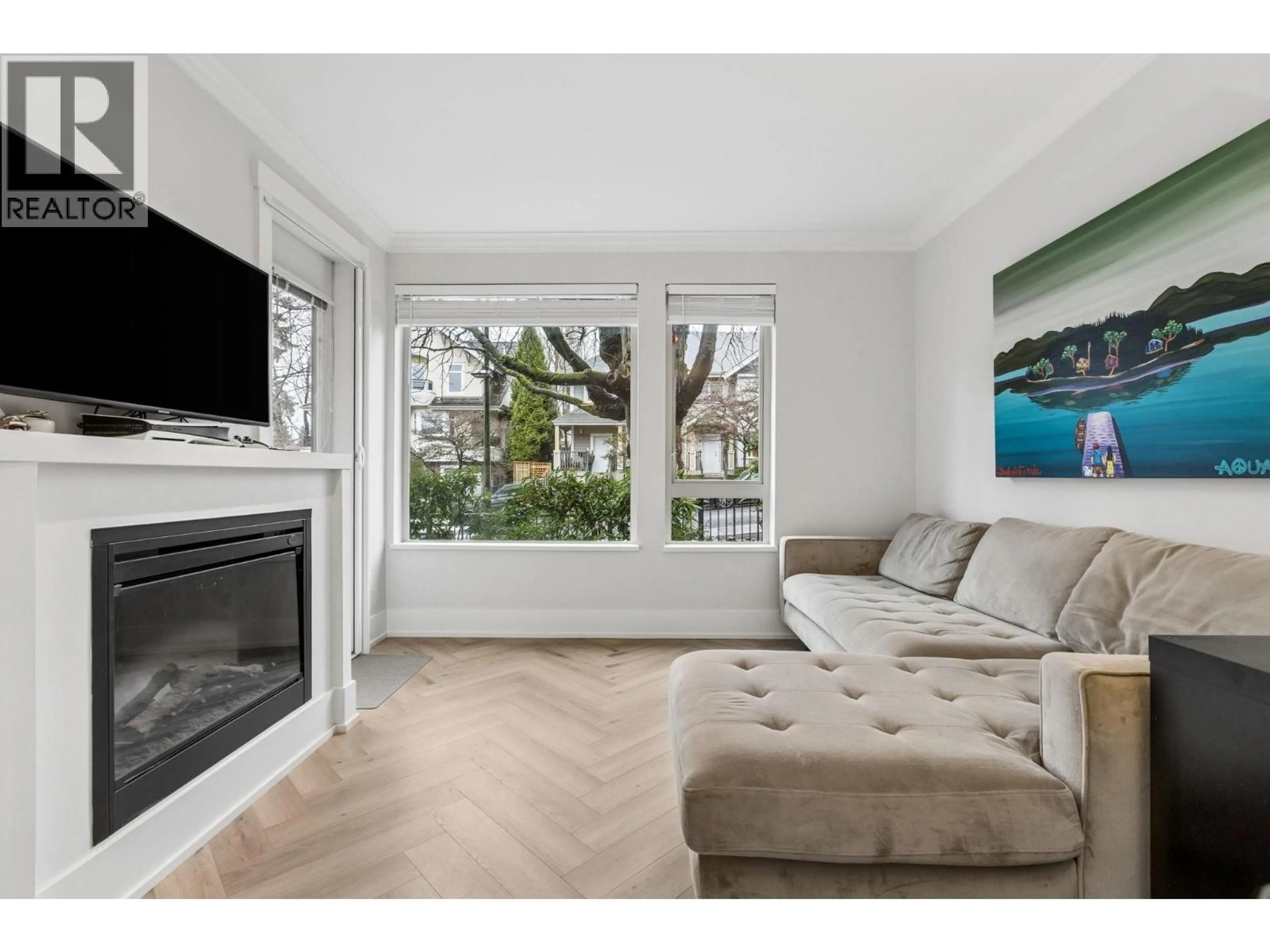 Living room with furniture, wood/laminate floor for 107 - 159 22ND STREET, North Vancouver British Columbia V7M0B6