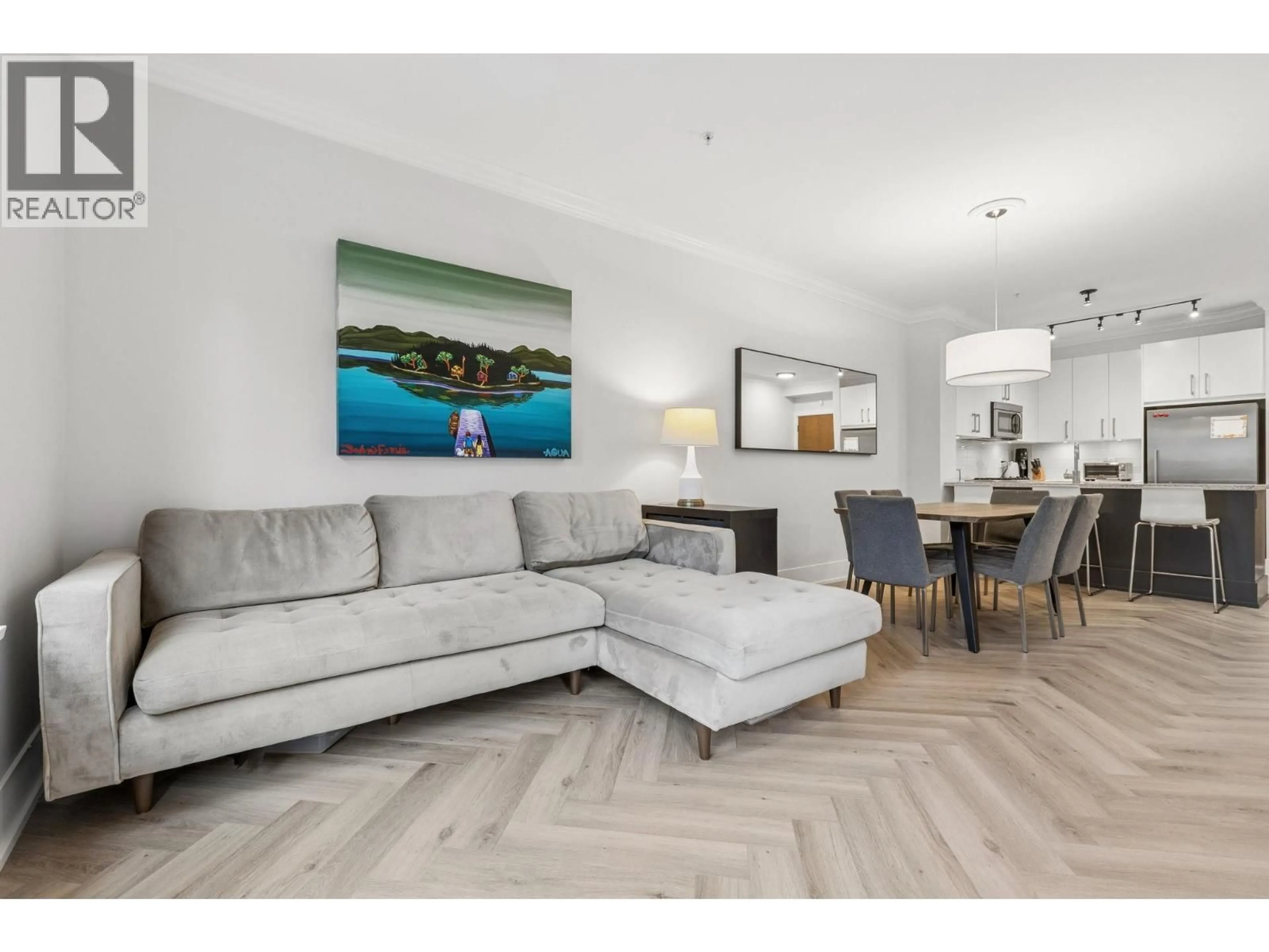 Living room with furniture, wood/laminate floor for 107 - 159 22ND STREET, North Vancouver British Columbia V7M0B6