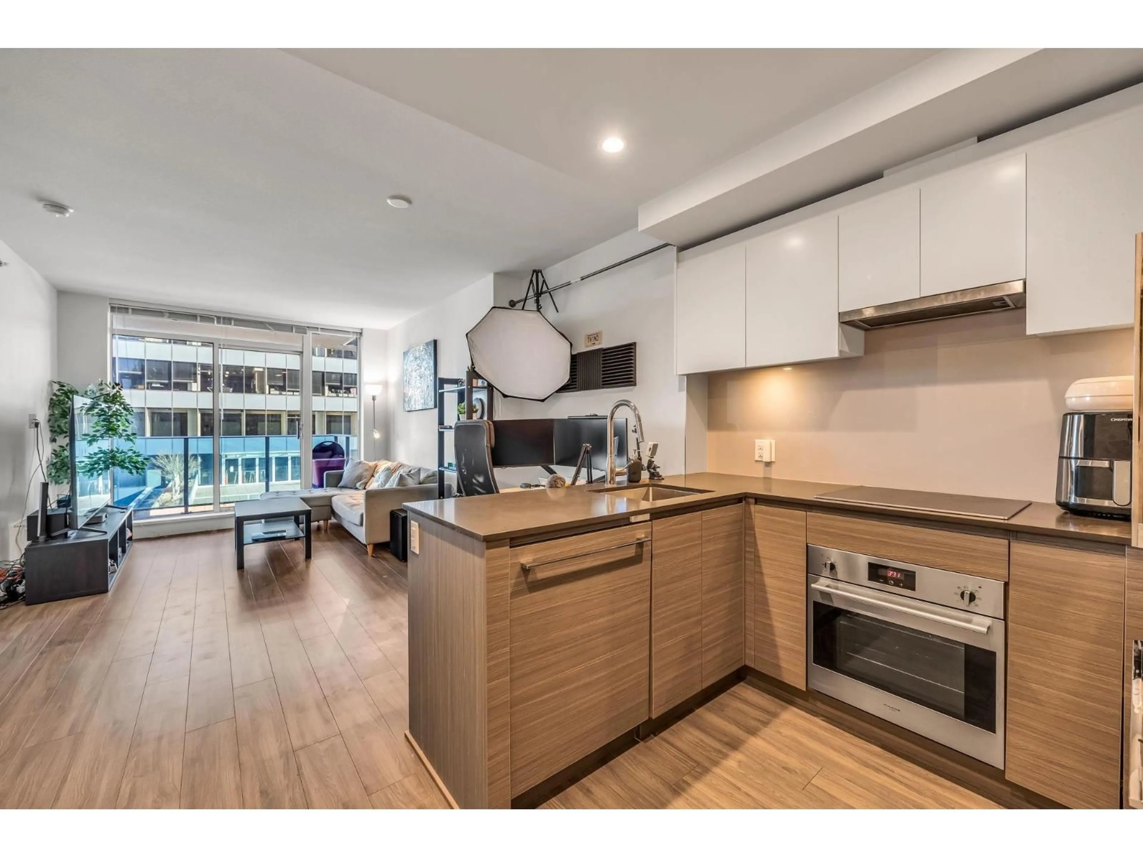 Open concept kitchen, wood/laminate floor for 705 - 13615 FRASER HIGHWAY, Surrey British Columbia V3T0P7