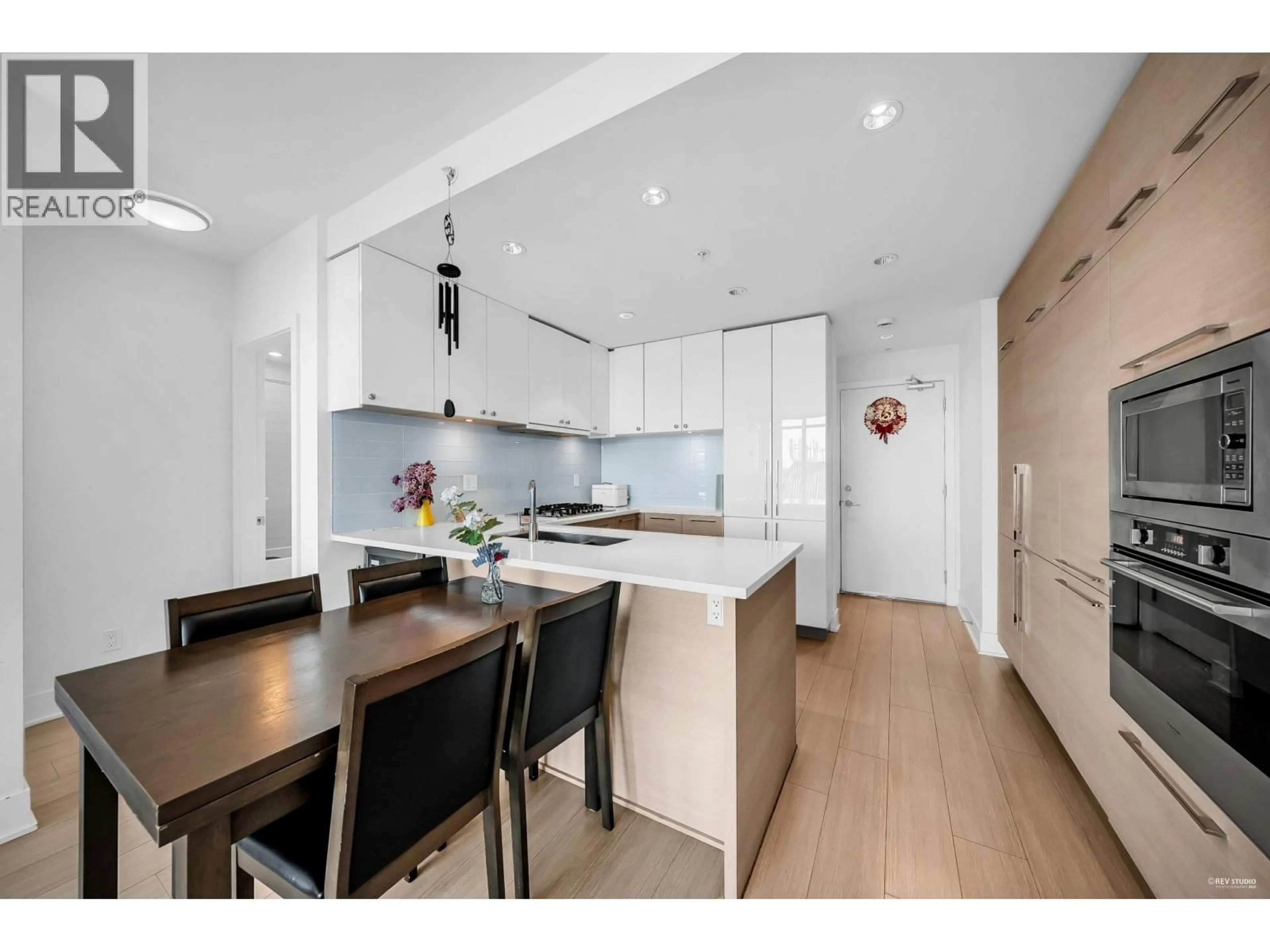 Open concept kitchen, wood/laminate floor for 1801 - 1188 PINETREE WAY, Coquitlam British Columbia V3B0K9