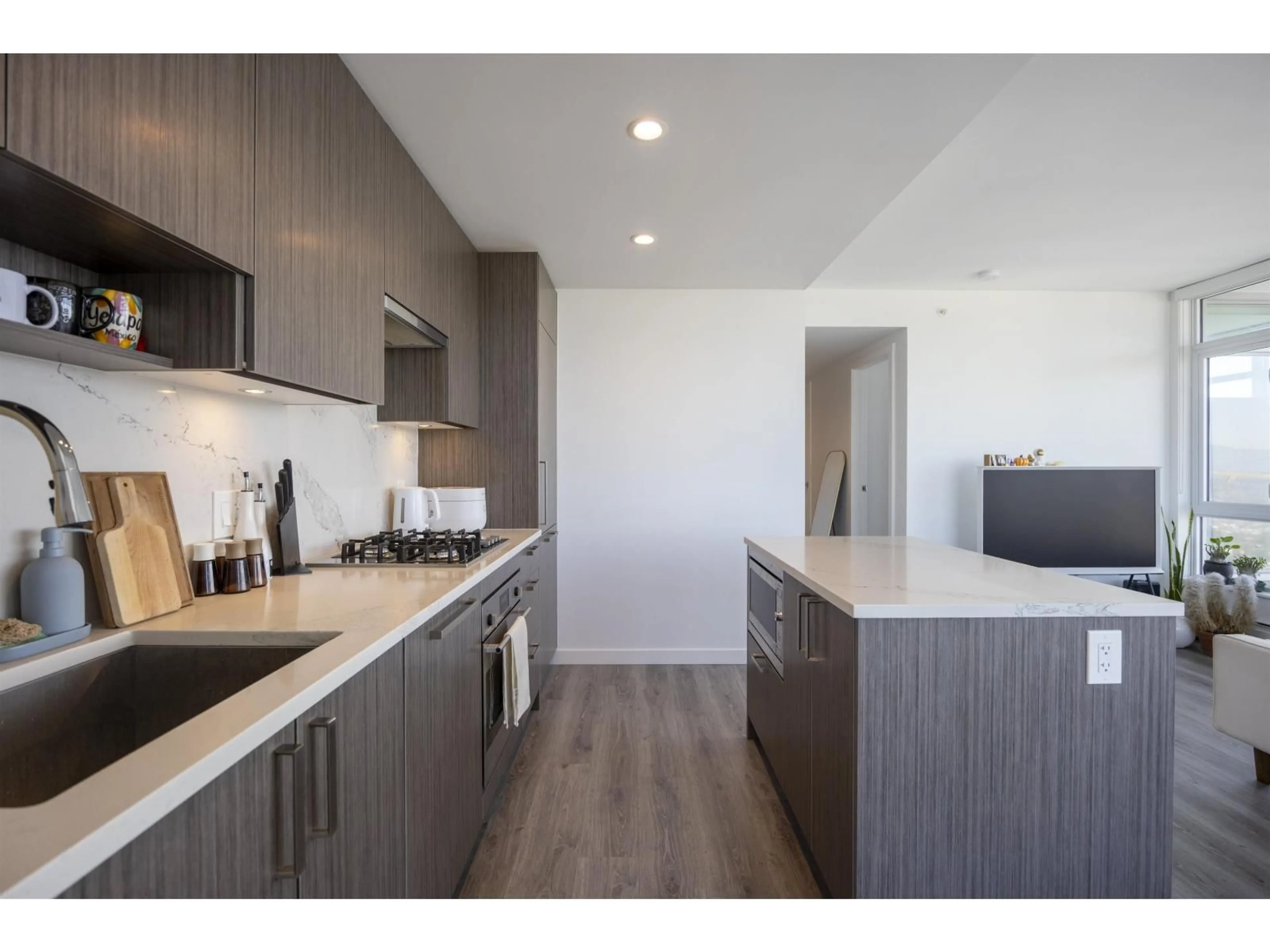 Open concept kitchen, wood/laminate floor for 3802 - 13350 CENTRAL AVENUE, Surrey British Columbia V3T0S1