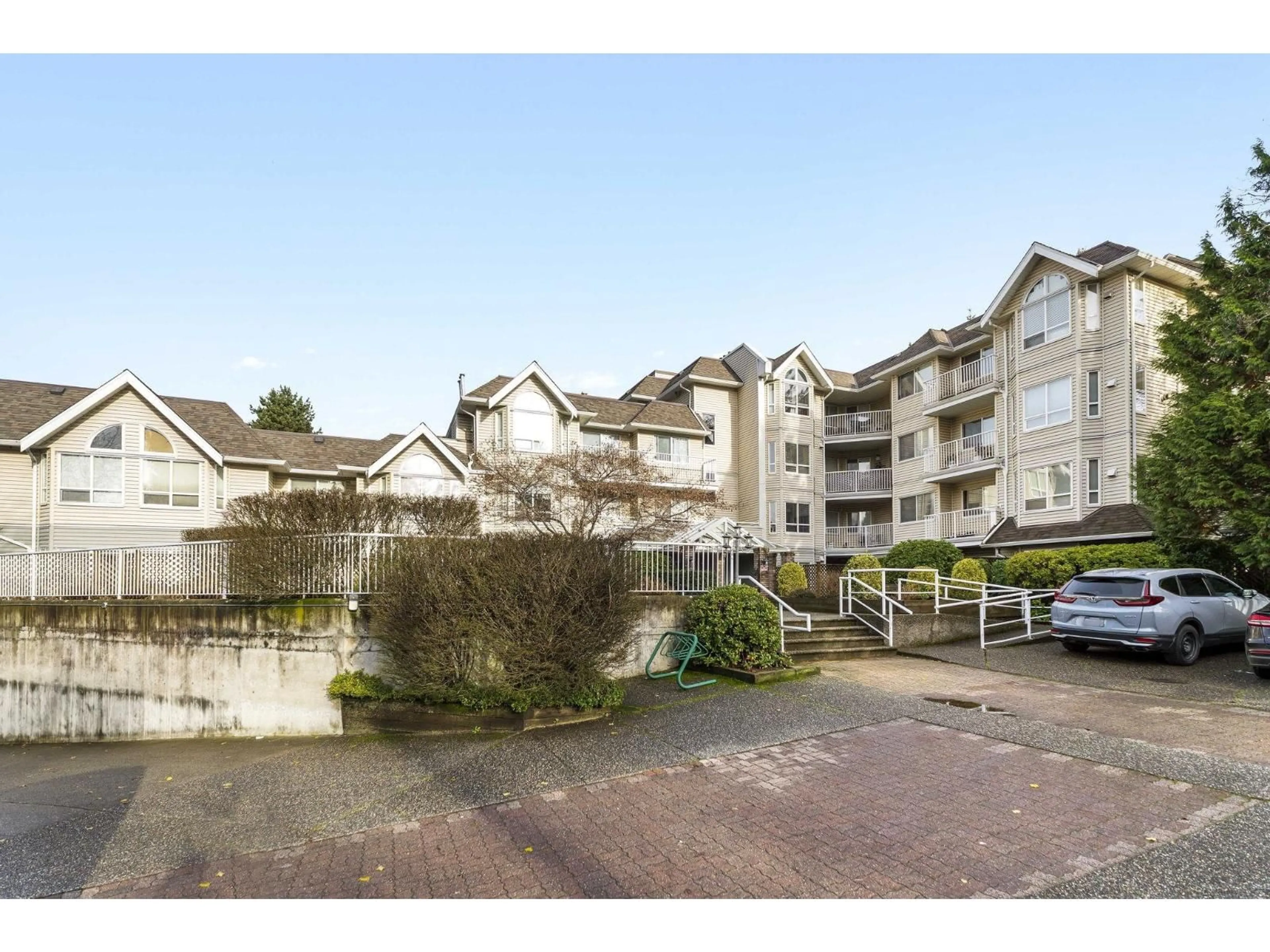 A pic from outside/outdoor area/front of a property/back of a property/a pic from drone, mountain view for 208 - 13475 96 AVENUE, Surrey British Columbia V3V1Y8