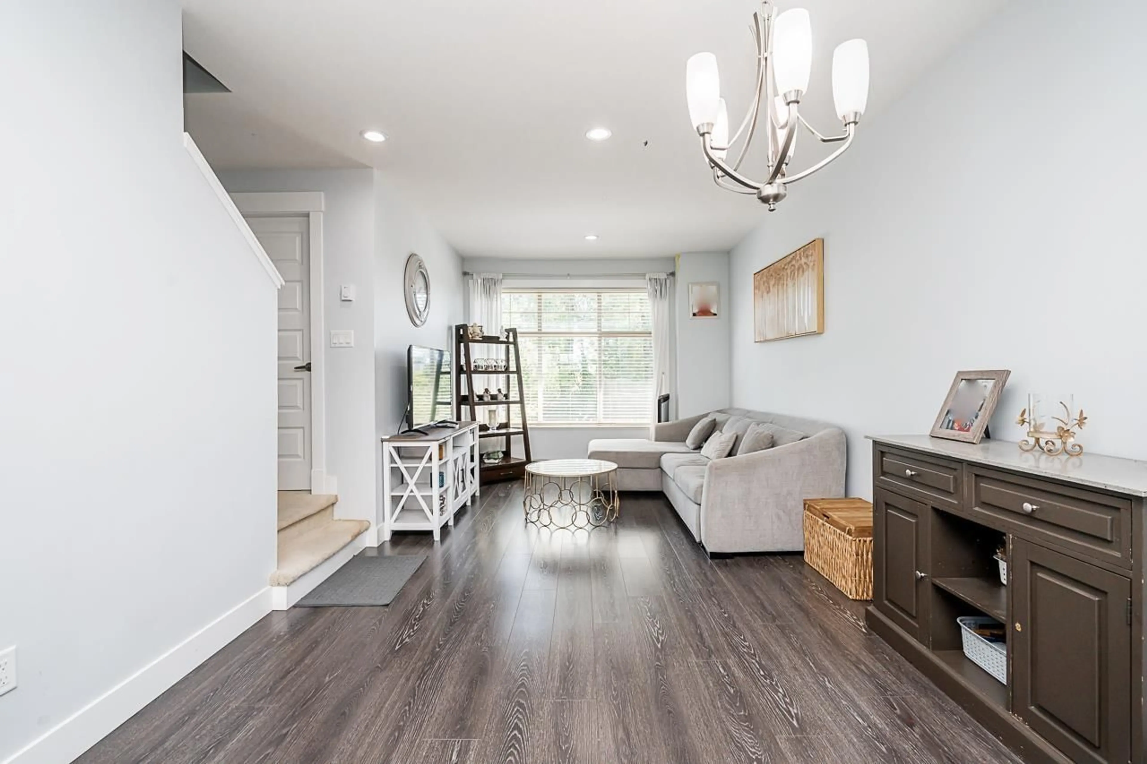 Living room with furniture, wood/laminate floor for 5 - 19525 73 AVENUE, Surrey British Columbia V4N6L7